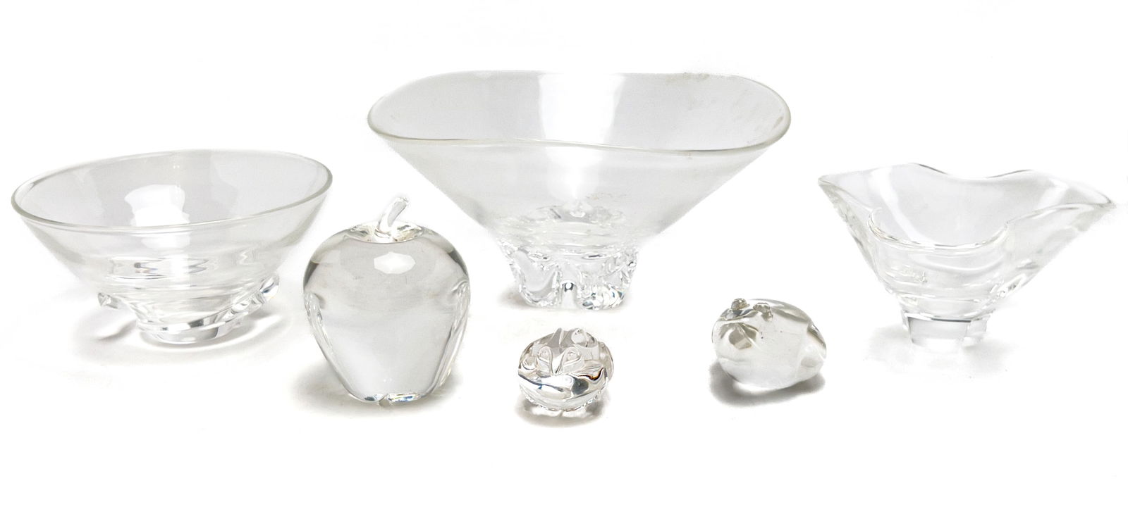 Steuben Glass - Bowls and Paperweights, Group of 6: Lot 160 Steuben Glass American (20th Century) Bowls and Paperweights, Group of 6 glass Comprising three glass center bowls, two glass frog shaped paperweights, and one apple paperweight marked to unde