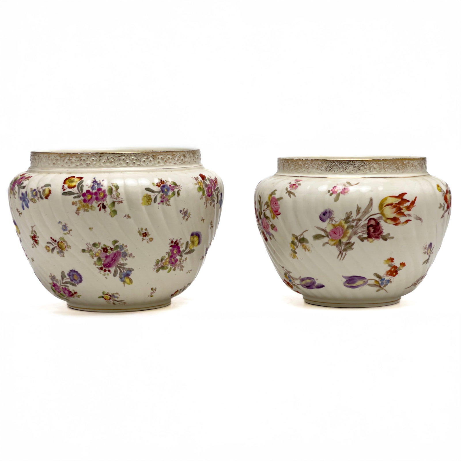 Floral Swirled Jardinieres, Pair: Lot 167 Floral Swirled Jardinieres, Pair porcelain Near pair of swirled jardinieres with all over floral pattern and gilt rim height (taller): 8 inches Provenance: The Estate of Nancy Sue Madden