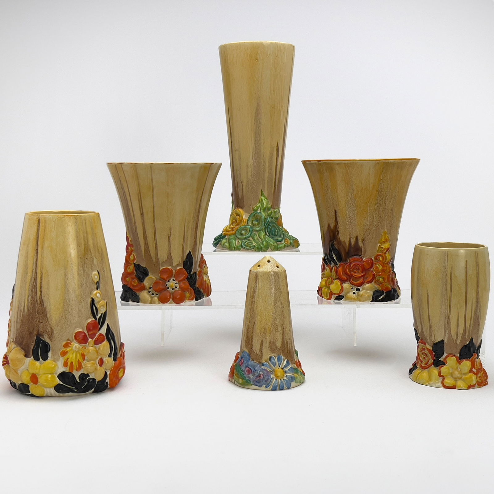 Clarice Cliff - Bizzare Vases and Shaker in ”My Garden,” Group of 6: Lot 80 Clarice Cliff English (1899-1972) Bizzare Vases and Shaker in ”My Garden,” Group of 6 hand-painted ceramic Comprising of five vases in varying styles and one shaker, each with the r