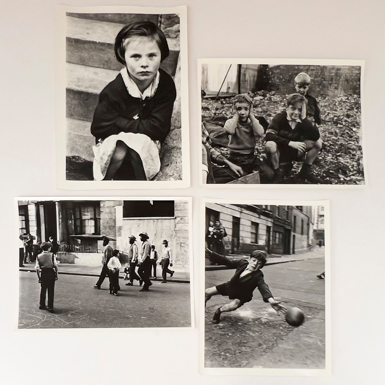 Roger Mayne - Post War Youths, Group of 4: Lot 103 Roger Mayne British (1929-2014) Post War Youths, Group of 4 press prints credit stamps to verso largest: 11 x 8 inches unframed Provenance: The Eugene and Dorothy Prakapas Estate