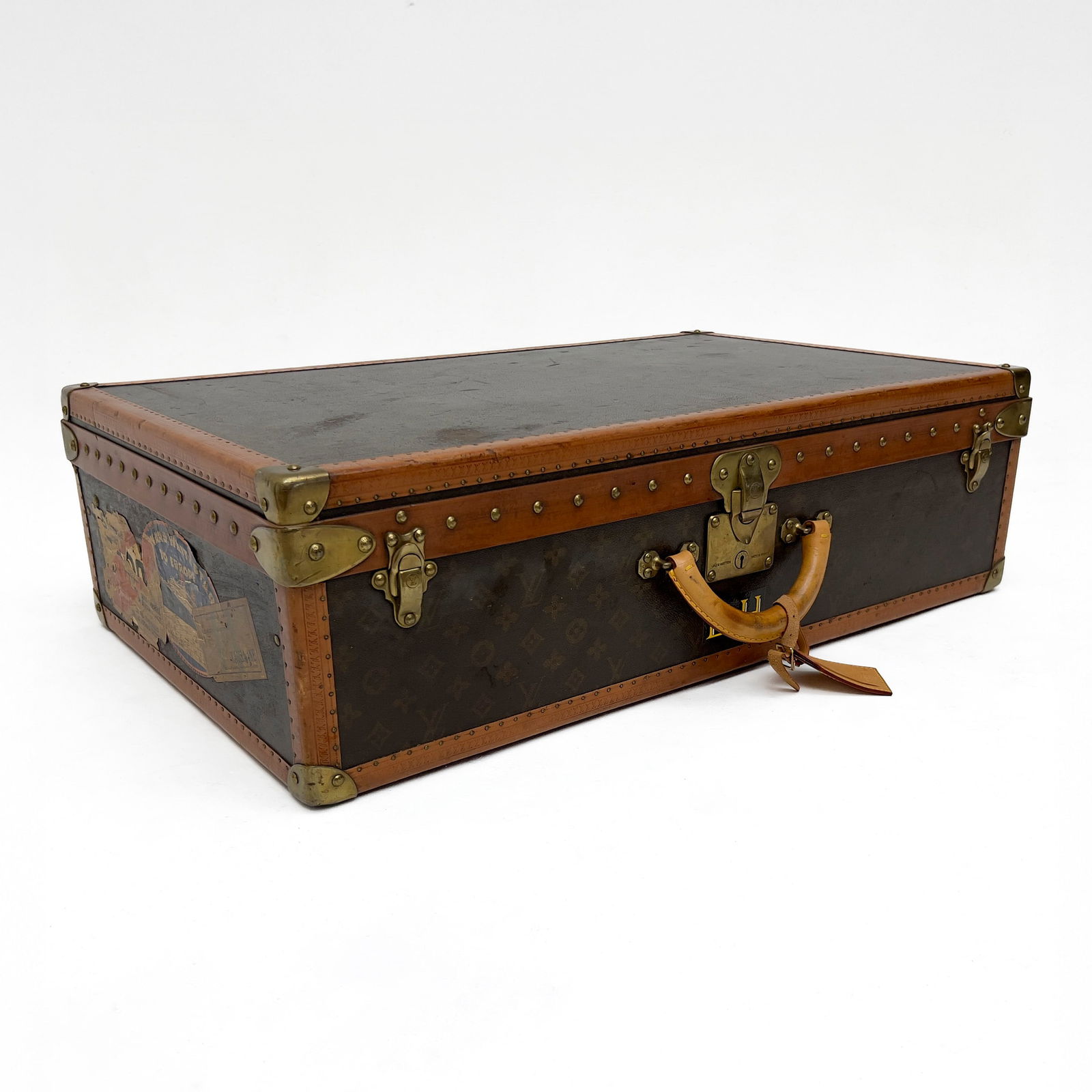 Louis Vuitton - Hard-Sided Luggage Case: Lot 196 Louis Vuitton French Manufacturer (Founded 1854) Hard-Sided Luggage Case Louis Vuitton Hard-Sided Suitcase in Monogram Canvas and Leather with Brass Hardware, Top Handle, and a Removable Compa