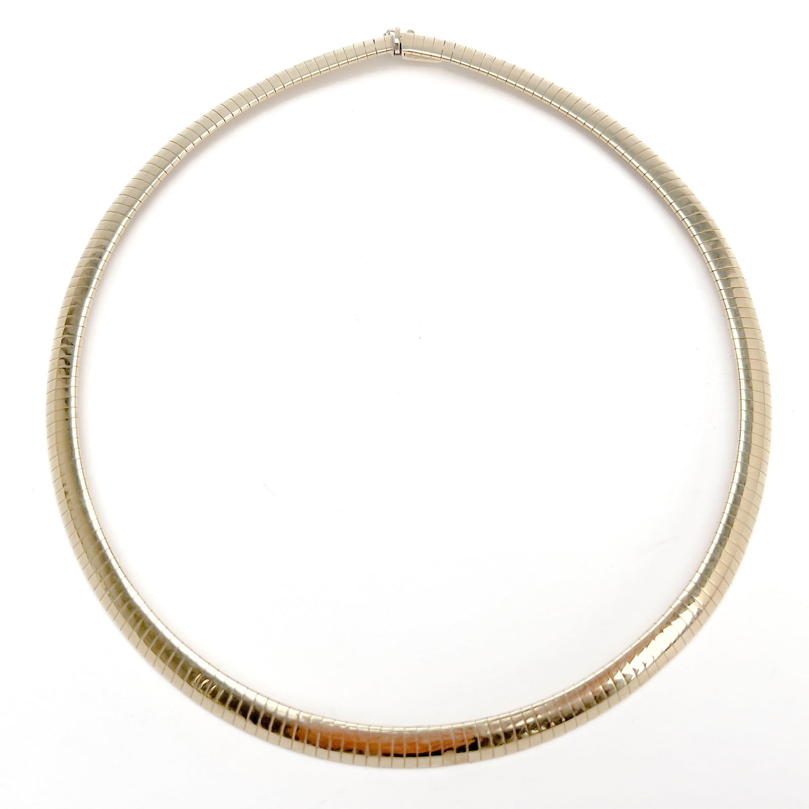 Gold Aurafin Omega Collar Necklace: Lot 14 Gold Aurafin Omega Collar Necklace 14k gold A 14k yellow gold omega link necklace by Aurafin total approximate weight: 30.4 grams stamped 14k Italy length: 15 1/2 inches