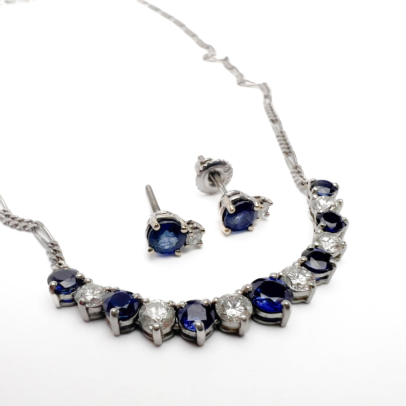 Diamond and Sapphire Balestra Italy Gold Necklace and Earring Set: Lot 16 Diamond and Sapphire Balestra Italy Gold Necklace and Earring Set sapphire, diamond, 14k gold Comprising a 14k white gold necklace and pair of earrings set with sapphire and diamonds approx 2.