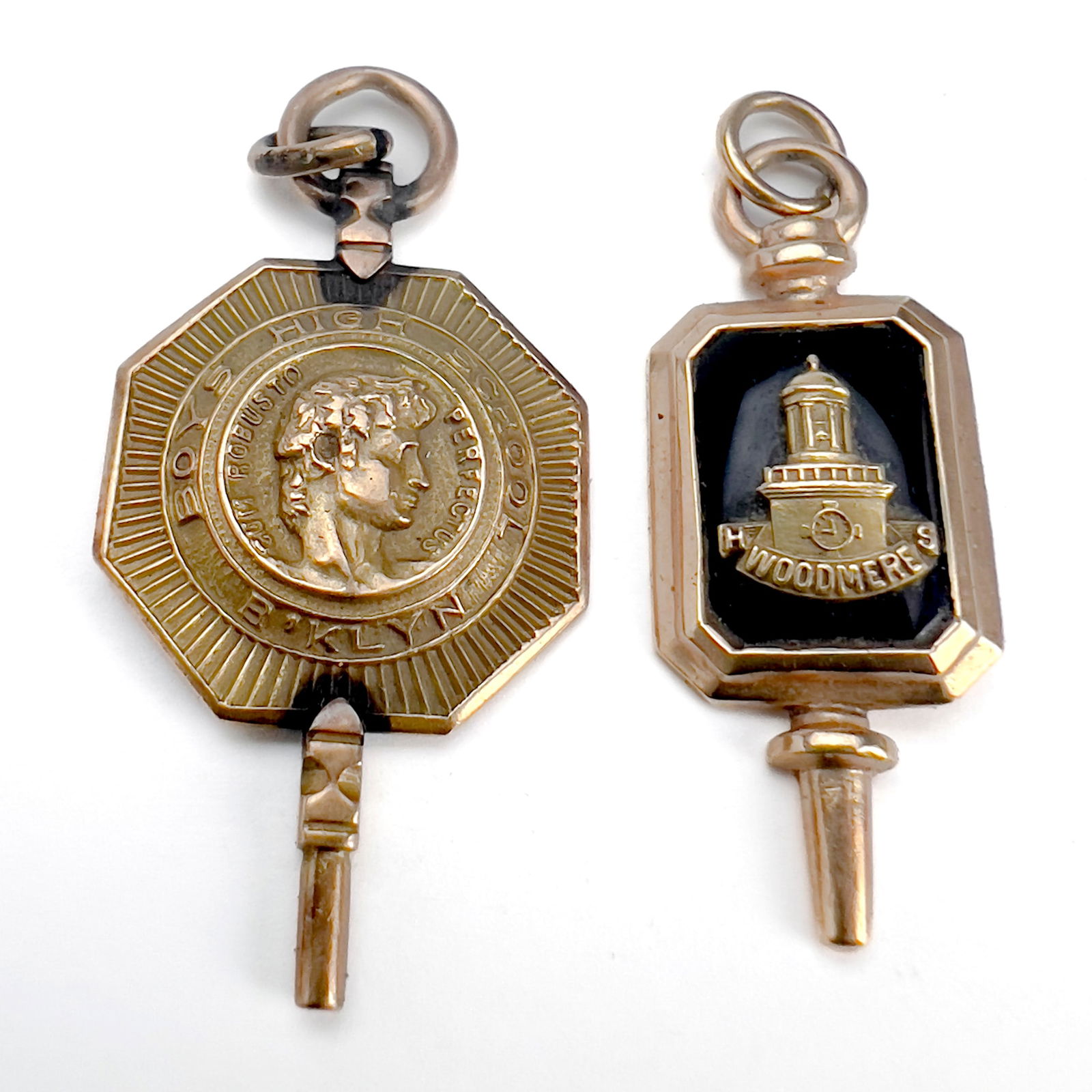 Two Gold New York High School Charms: Lot 52 Two Gold New York High School Charms 10k gold Two 10k gold school pendant charms, one set with onyx for Woodmere High School, one for Brooklyn Boys High School total approximate weight: 8.9 gr