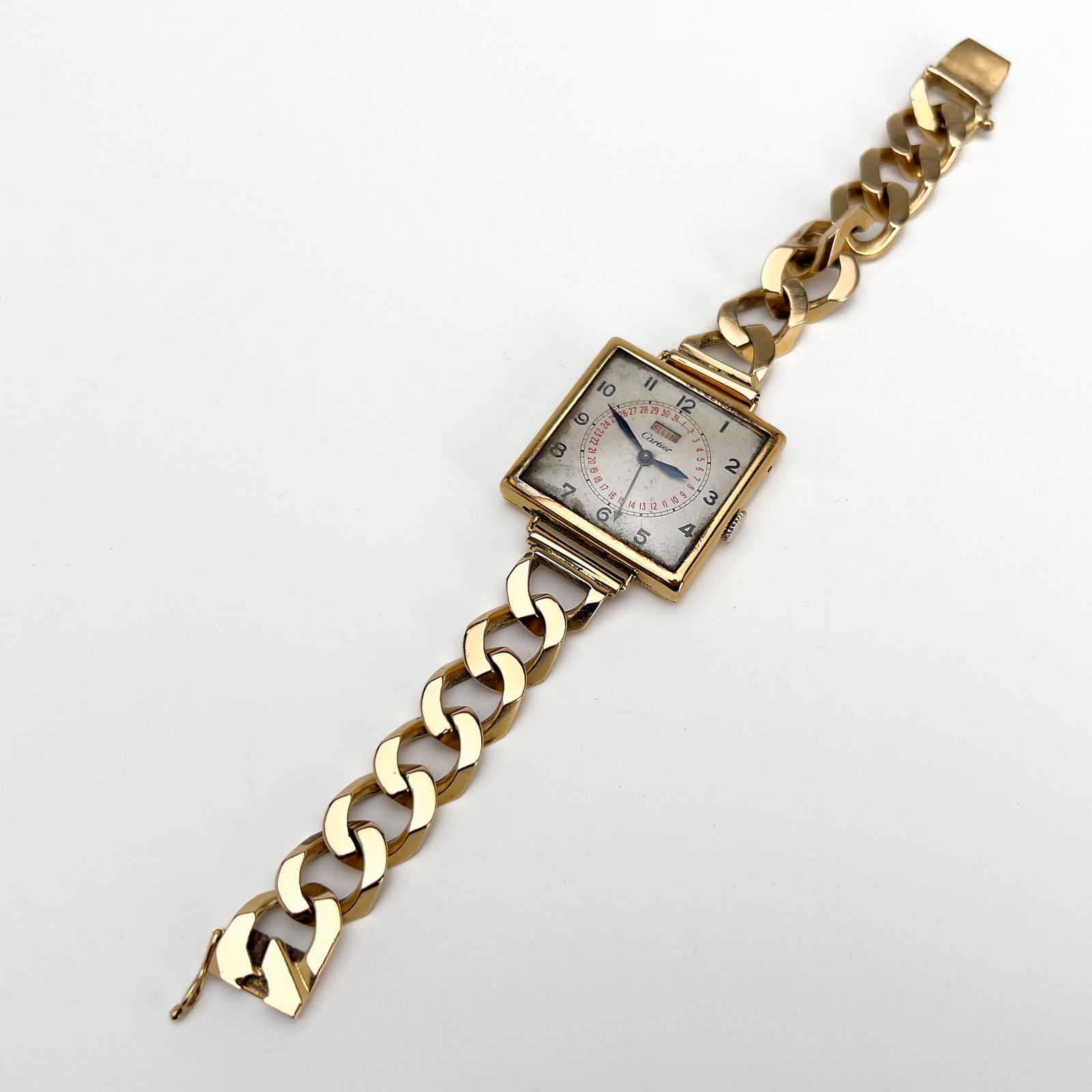 Cartier - Gold Square Case Watch: Lot 74 Cartier French Manufacturer (Founded 1847) Gold Square Case Watch 14k gold A gold square case wristwatch with a chunky curb link bracelet by Cartier, works by LeCoultre Co., 17 jewel mechanism,