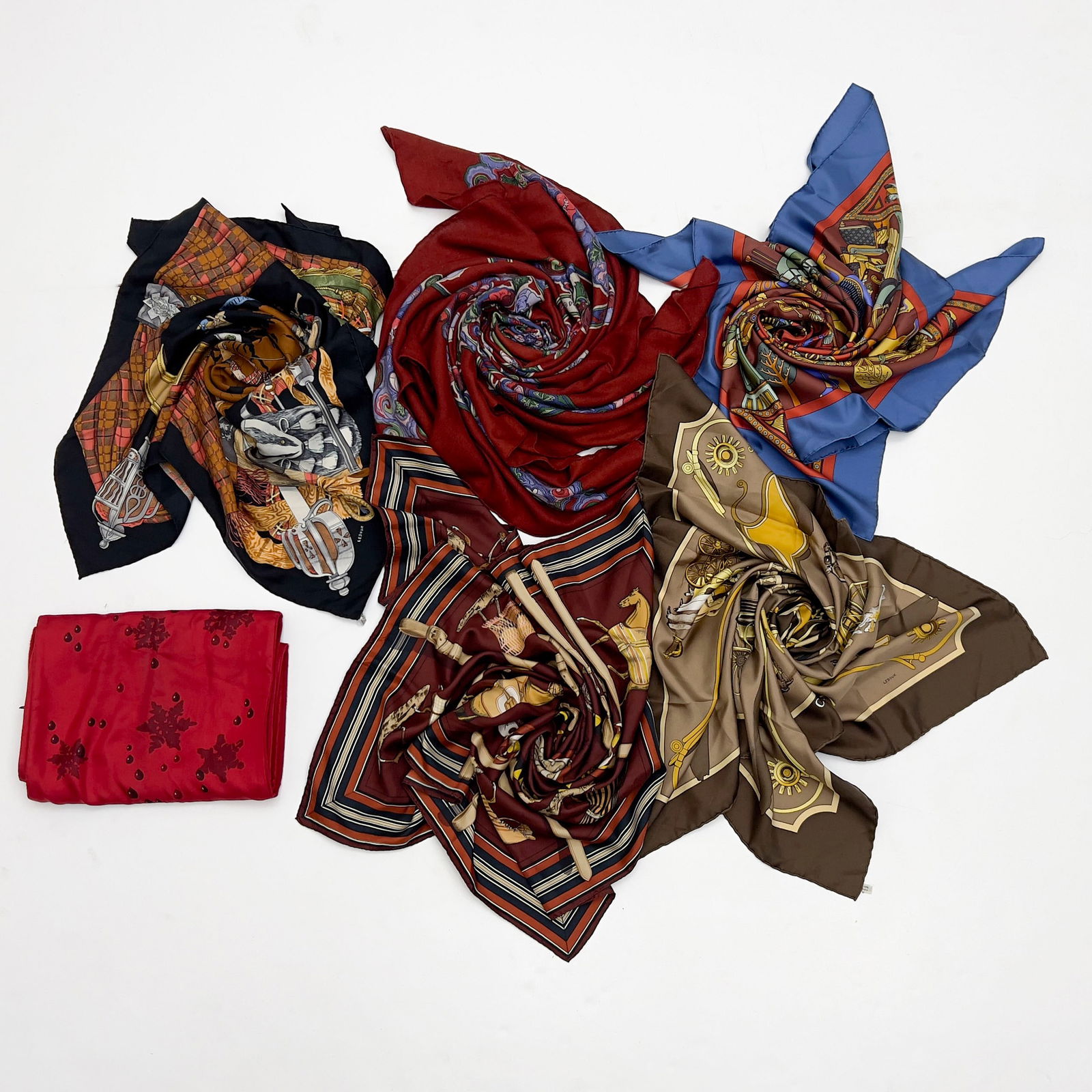 Hermès - Silk Scarves, Group of 6: Lot 90 Hermès French Manufacturer (Founded 1837) Silk Scarves, Group of 6 silk Hemès scarf group, comprising of Couvertures et Tenues de Jour, Scotland, Carrossier, Persepolis, and two unknown desig