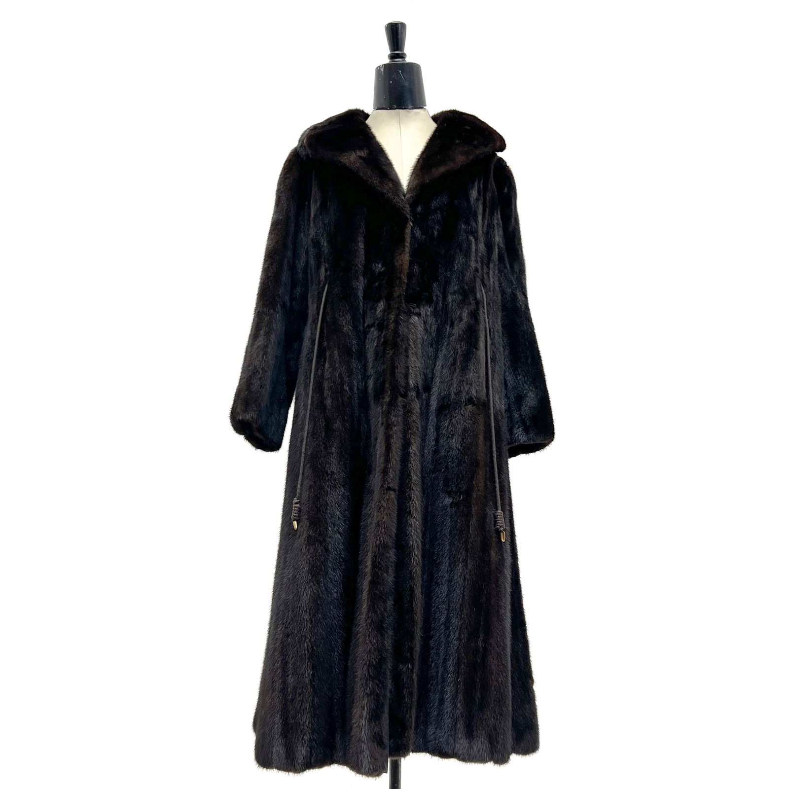 Full Length Fur Coat: Lot 106 Full Length Fur Coat A long dark brown fur coat, likely mink, with a drawstring to sinch waist, two interior pockets, and two exterior pockets length: 44 inches Additional Information: All ga