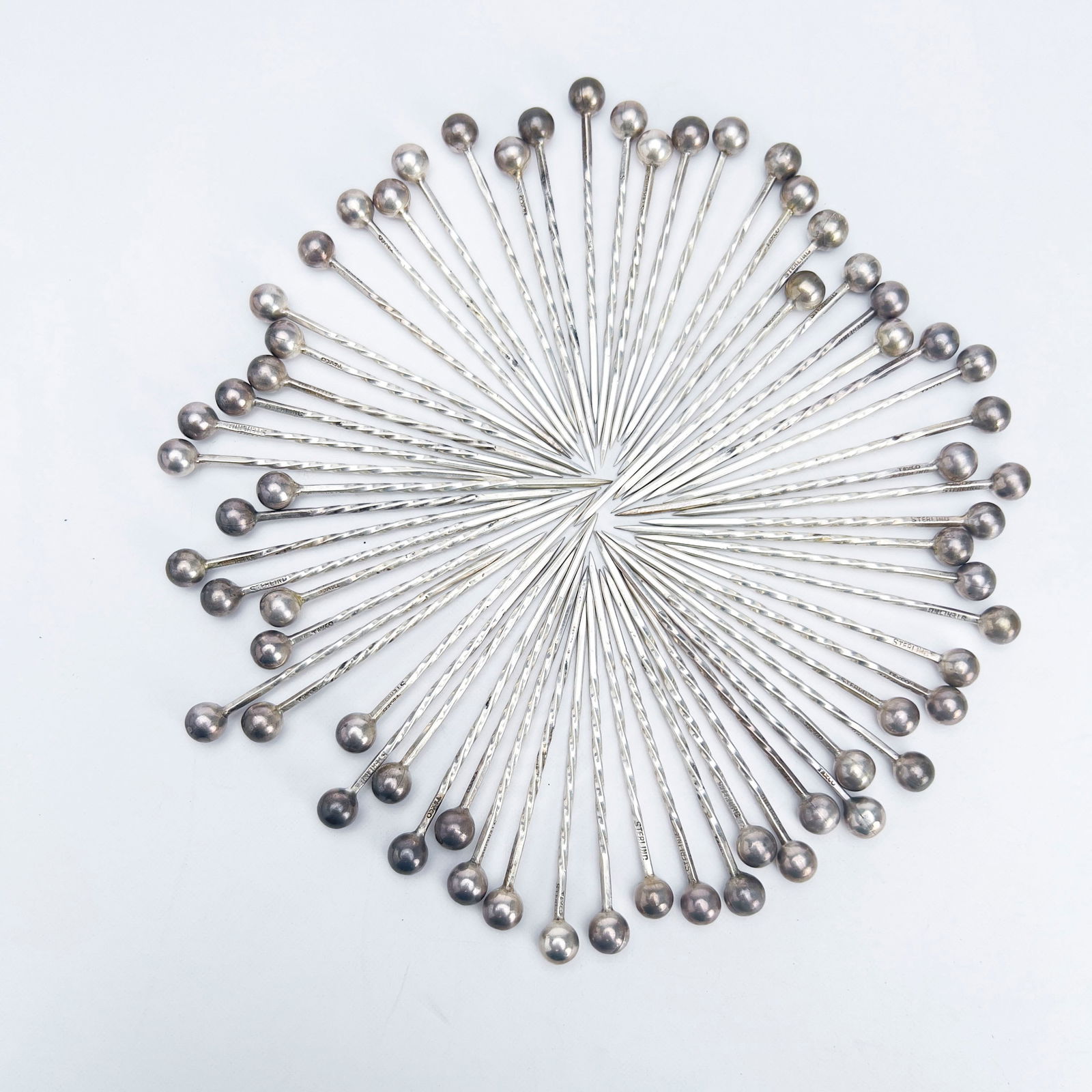 Silver Appetizer Picks, Group of 60+: Lot 128 Silver Appetizer Picks, Group of 60+ sterling silver Sterling silver appetizer picks, total approximate weight: 161 grams each marked taxco and sterling length: 3 inches Provenance: From a