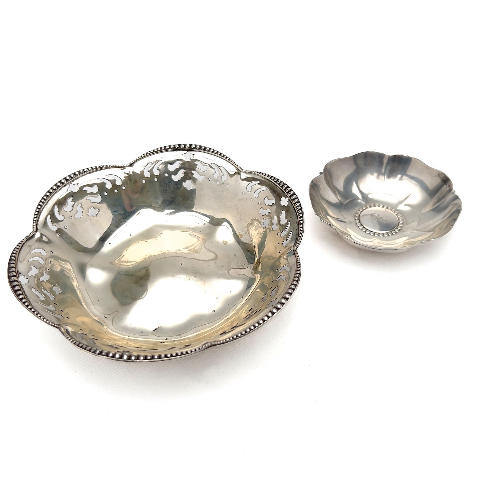 Tiffany & Co. - Two Silver Flower Bowls: Lot 136 Tiffany & Co. American Manufacturer (Founded 1837) Two Silver Flower Bowls sterling silver Tiffany sterling silver group, comprising of two sterling flower-shaped serving bowls by Tiffany & Co