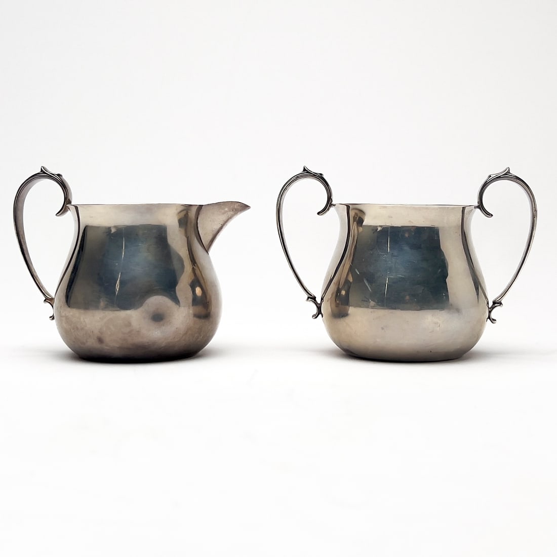 Silver Sugar and Creamer: Lot 137 Silver Sugar and Creamer sterling silver Sterling silver group, comprising of one sterling sugar bowl and one cream jug total approximate weight: 276 grams each marked height: 3 1/2 inches 