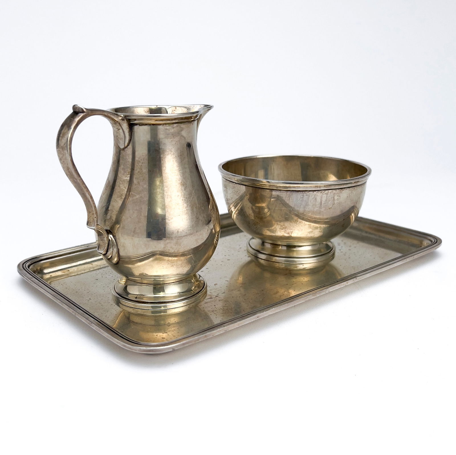 Tiffany & Co. - Silver Sugar and Cream Set with Tray: Lot 144 Tiffany & Co. American Manufacturer (Founded 1837) Silver Sugar and Cream Set with Tray sterling silver Tiffany silver group, comprising of a sterling silver Tiffany & Co sugar bowl and cream