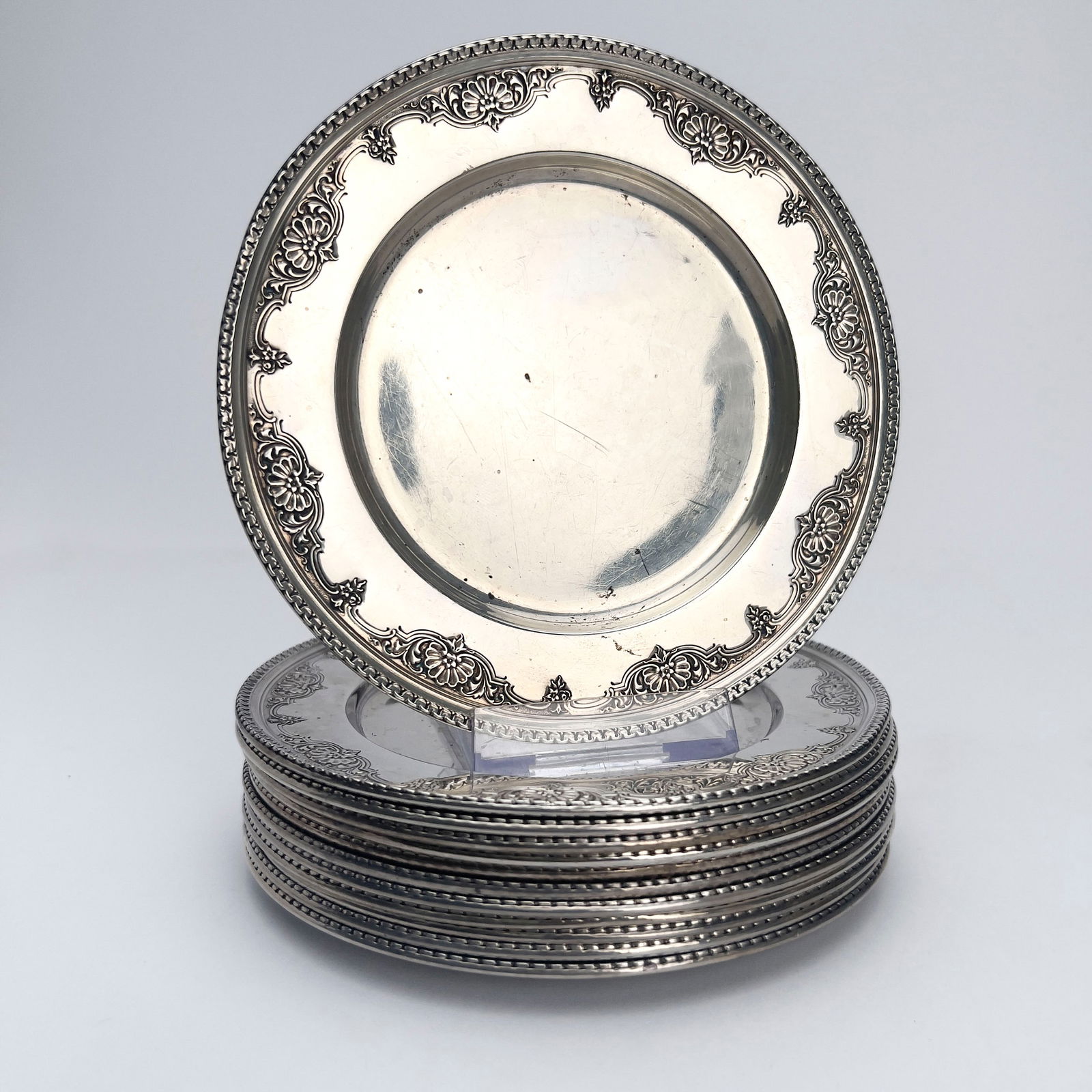 R. Wallace & Sons - Silver Sir Christopher Plates, Set of 12: Lot 148 R. Wallace & Sons American (Founded in 1835) Silver Sir Christopher Plates, Set of 12 sterling silver total approximate weight: 879 grams each hallmarked diameter: 6 inches Provenance: From
