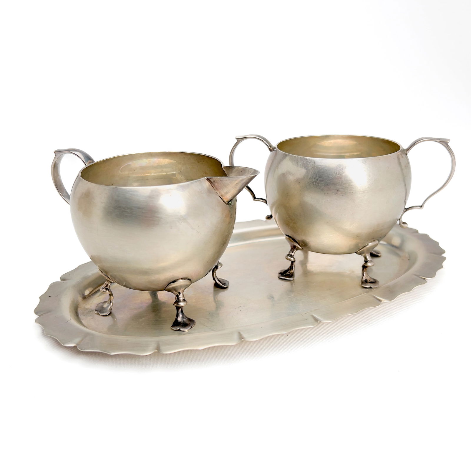 Moss Silver Sugar and Cream Set with Tray: Lot 150 Moss Silver Sugar and Cream Set with Tray sterling silver Sterling silver group, comprising of one sterling sugar bowl, one cream jug, and a matching tray all stamped Moss total approximate