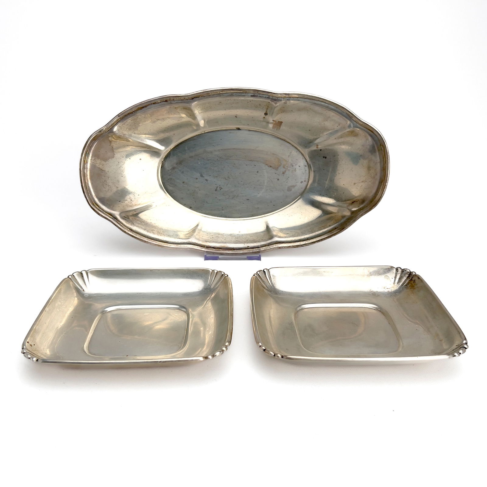 Three Silver Serving Trays: Lot 153 Three Silver Serving Trays sterling silver Sterling silver group, comprising of two small square sterling trays by Wallace & Sons, and one longer sterling serving tray total approximate