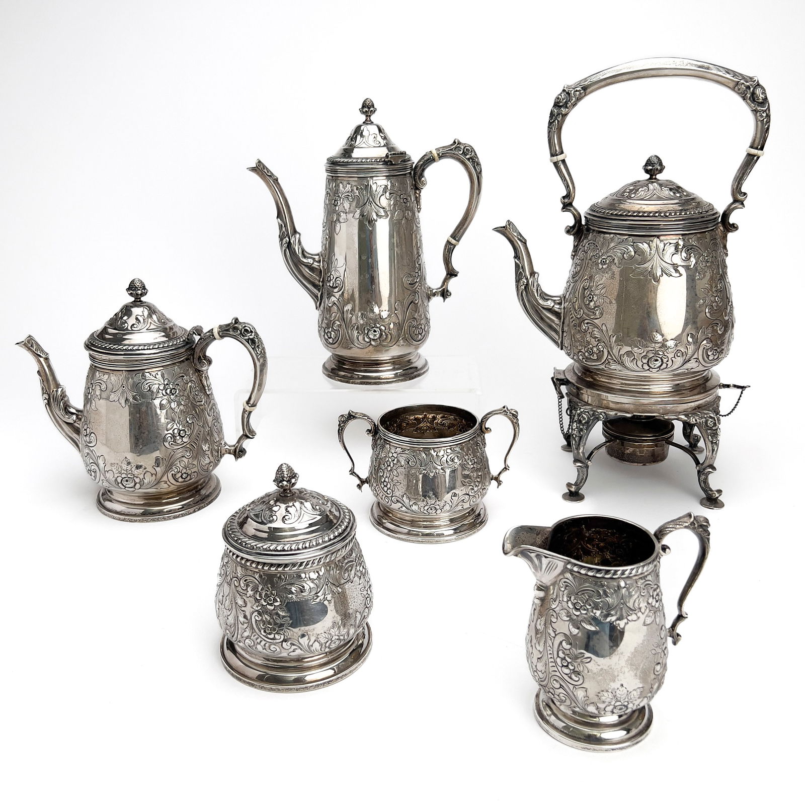 Durham Silver Coffee and Tea Service: Lot 159 Durham Silver Coffee and Tea Service (circa 1955) Sterling silver hollowware set includes kettle with stand, teapot, coffee pot, creamer, as well as two sugar bowls (one with two handles)