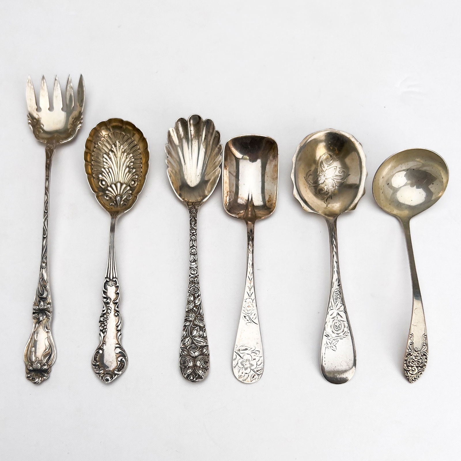 Silver Flatware, Group of 6: Lot 176 Silver Flatware, Group of 6 sterling silver Sterling silver group, comprising of four spoons, one ladle, and one fork 160 grams each marked length (fork): 7 1/2 inches Provenance: From a