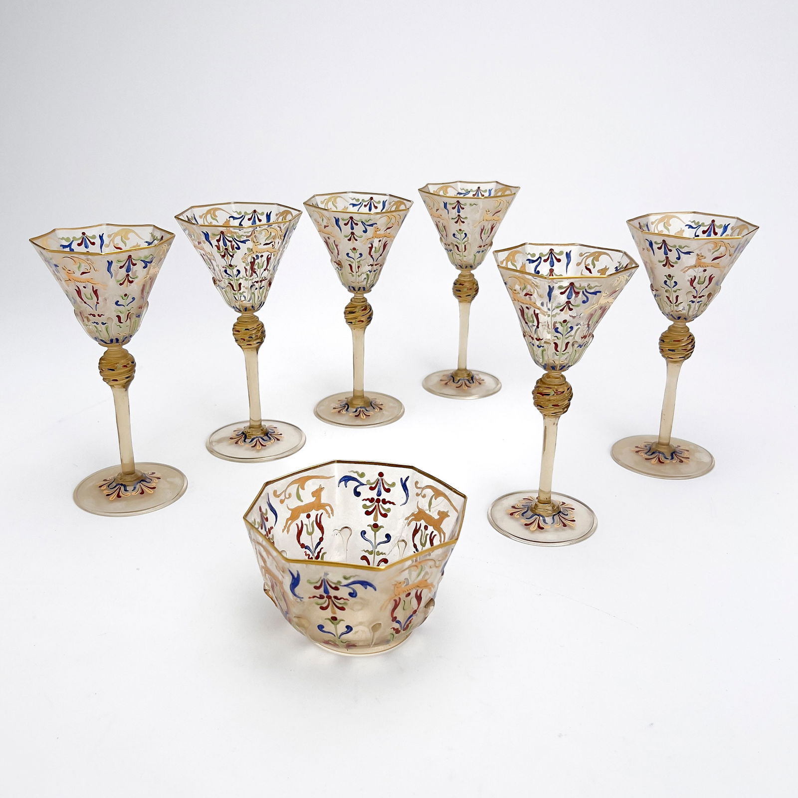 Salviati (attributed) ,Stemware Group: Lot 199 Salviati (attributed) ,Stemware Group Hand Painted Moser Canine and Foliate Glassware attributed to Salviati, group includes 6 glasses and one bowl (with old repair) glass: 6 1/2 x 3 inches