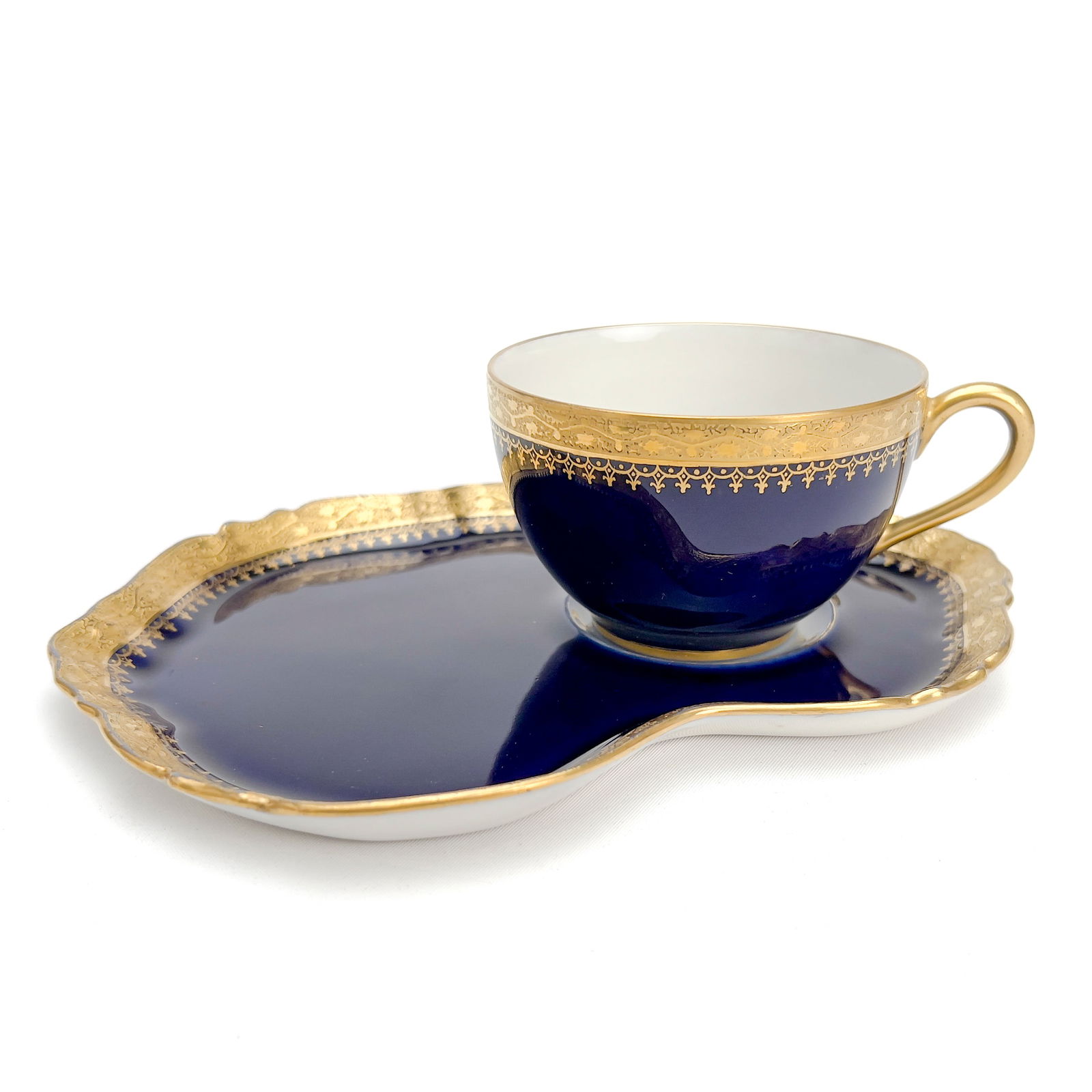 Limoge Cups and Saucers, Group of 23: Lot 205 Limoge Cups and Saucers, Group of 23 porcelain Limoges porcelain group, comprising ten cups of the same design marked ”sas”, two cups slightly wider and shallower with W.G. & Co