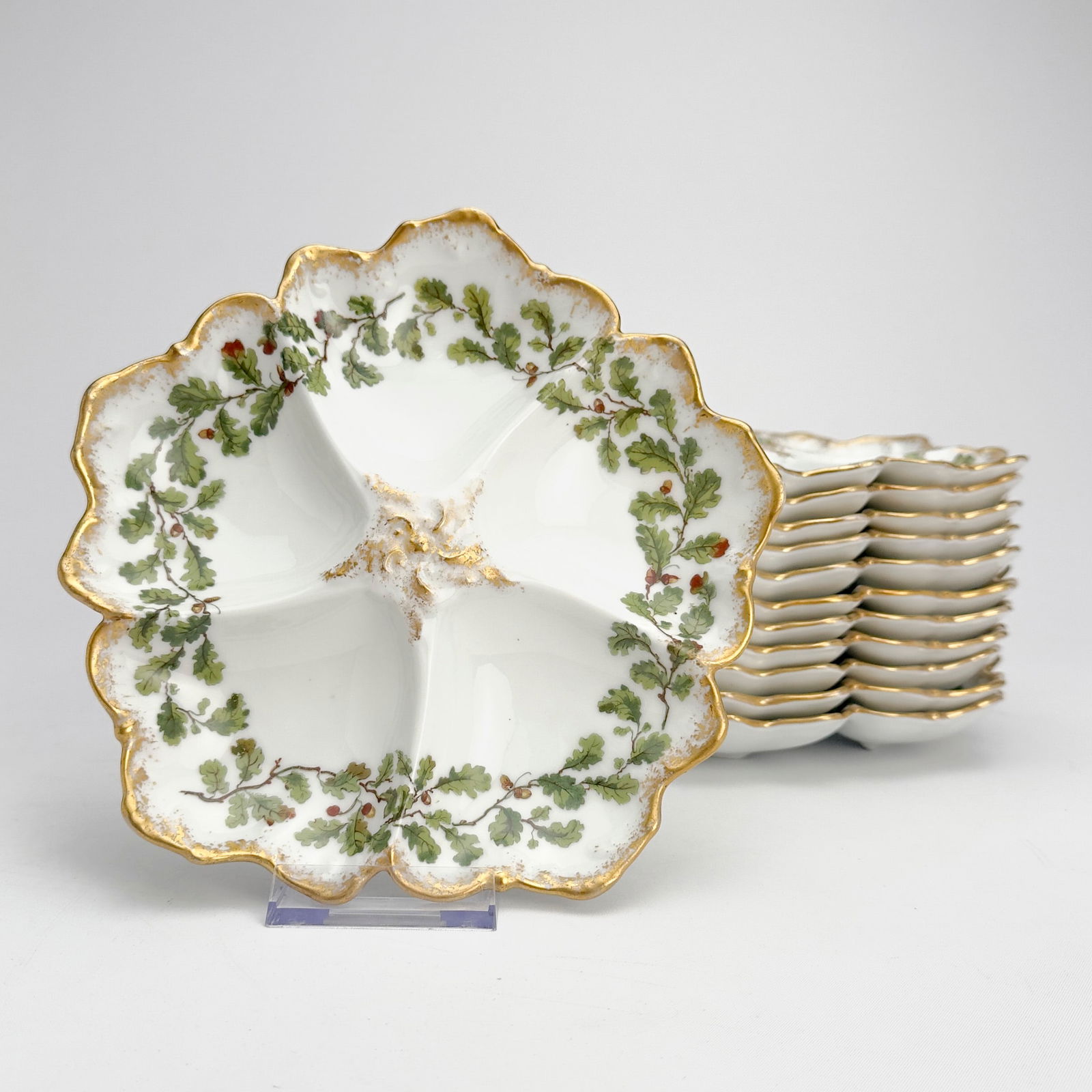 Tressemanes & Vogt - Limoges Oyster Plates, Set of 12: Lot 223 Tressemanes & Vogt French Manufacturer (est. 1891) Limoges Oyster Plates, Set of 12 porcelain Comprising twelve porcelain oyster plates made by Tressemanes & Vogt, Limoges France. Features