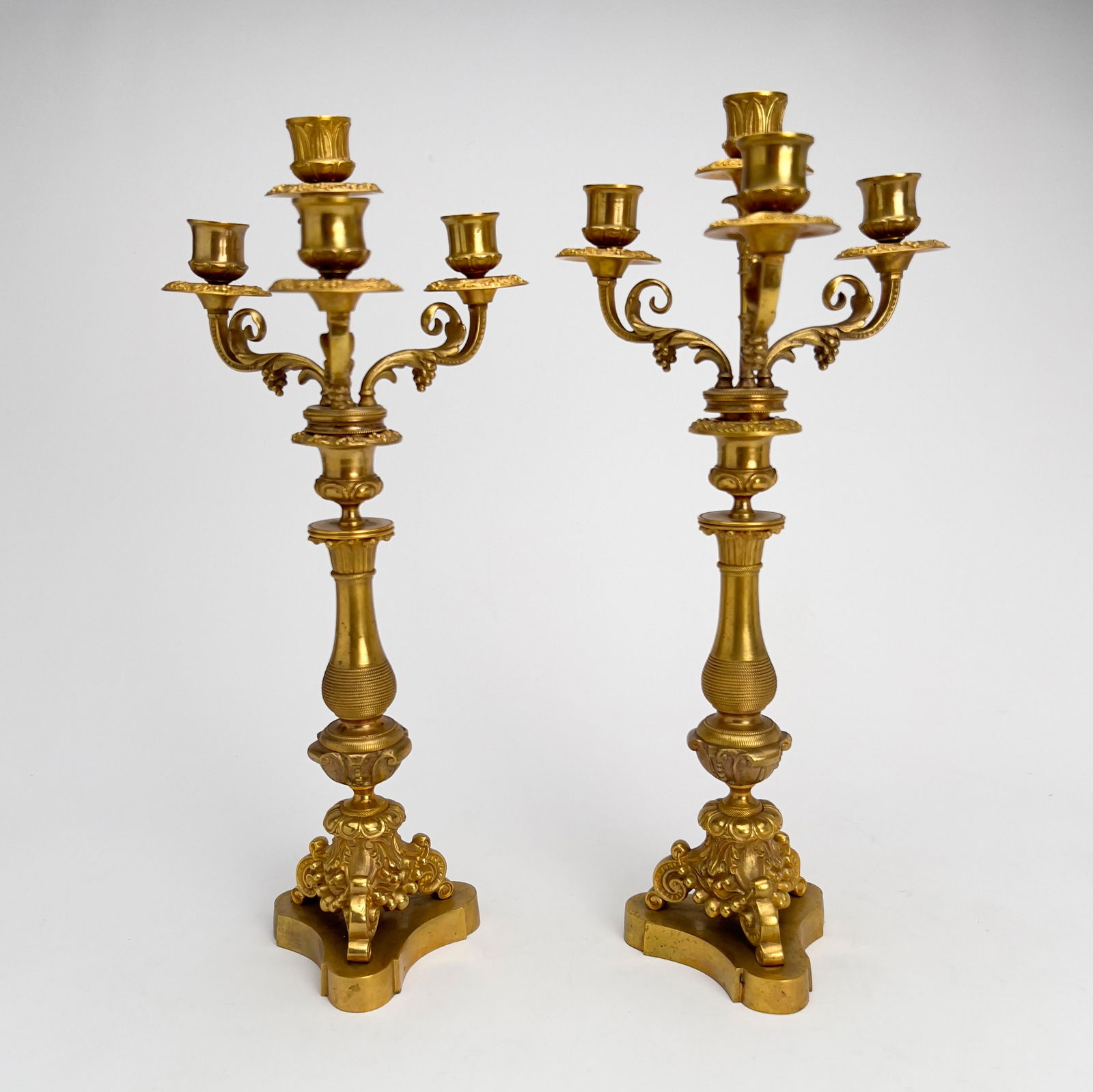 Pair of French, Gilt Bronze Candelabras: Lot 256 Pair of French, Gilt Bronze Candelabras bronze Well chased French gilt bronze candelabra pair, two-piece design with four lights each. height (each): 17 inches