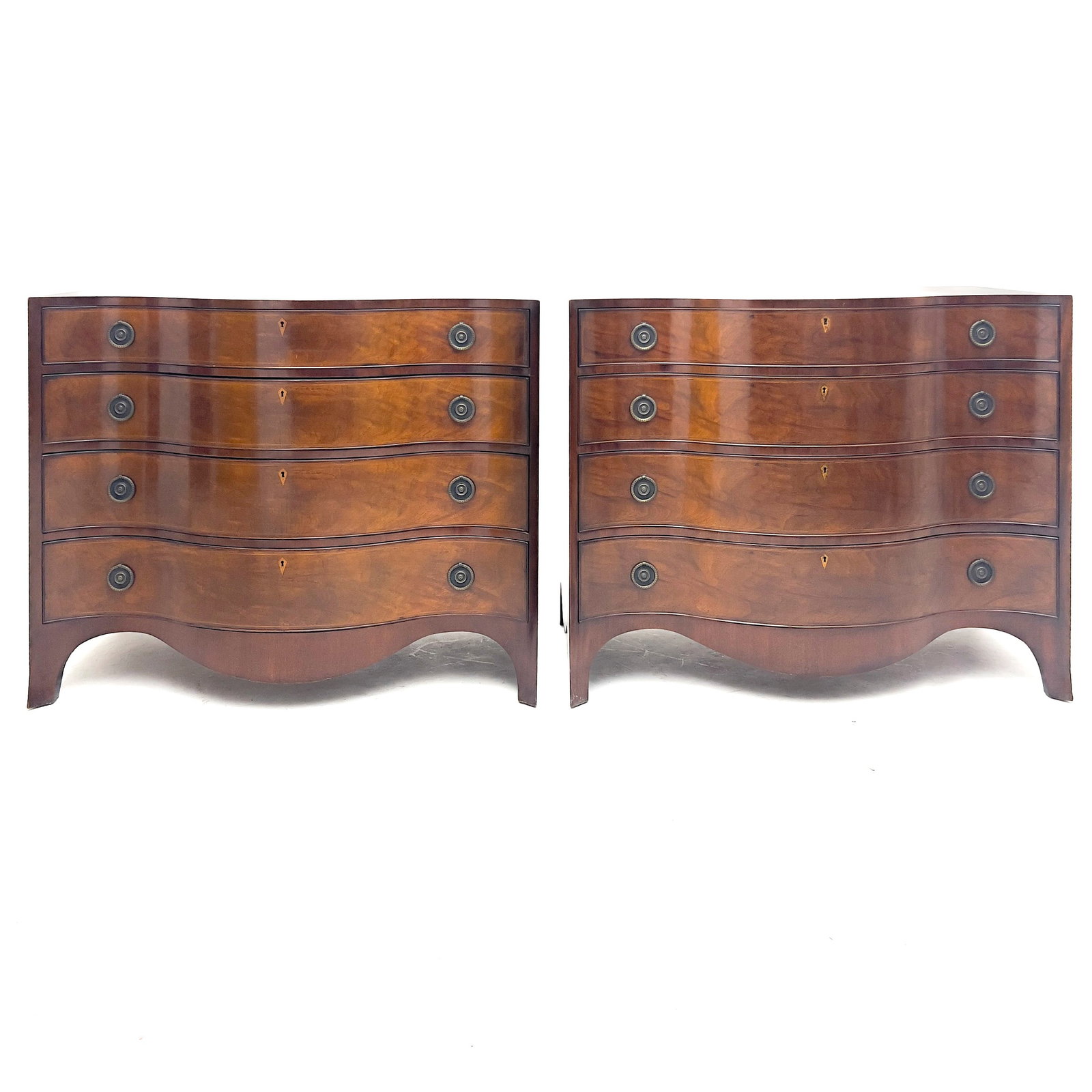 Beacon Hill - George III Style Serpentine Front Dressers, Pair: Lot 57 Beacon Hill American Manufacturer (1937-1972) George III Style Serpentine Front Dressers, Pair (circa 1950) mahogany, brass each: 34 3/4 x 42 x 22 inches with label inside drawer Description: