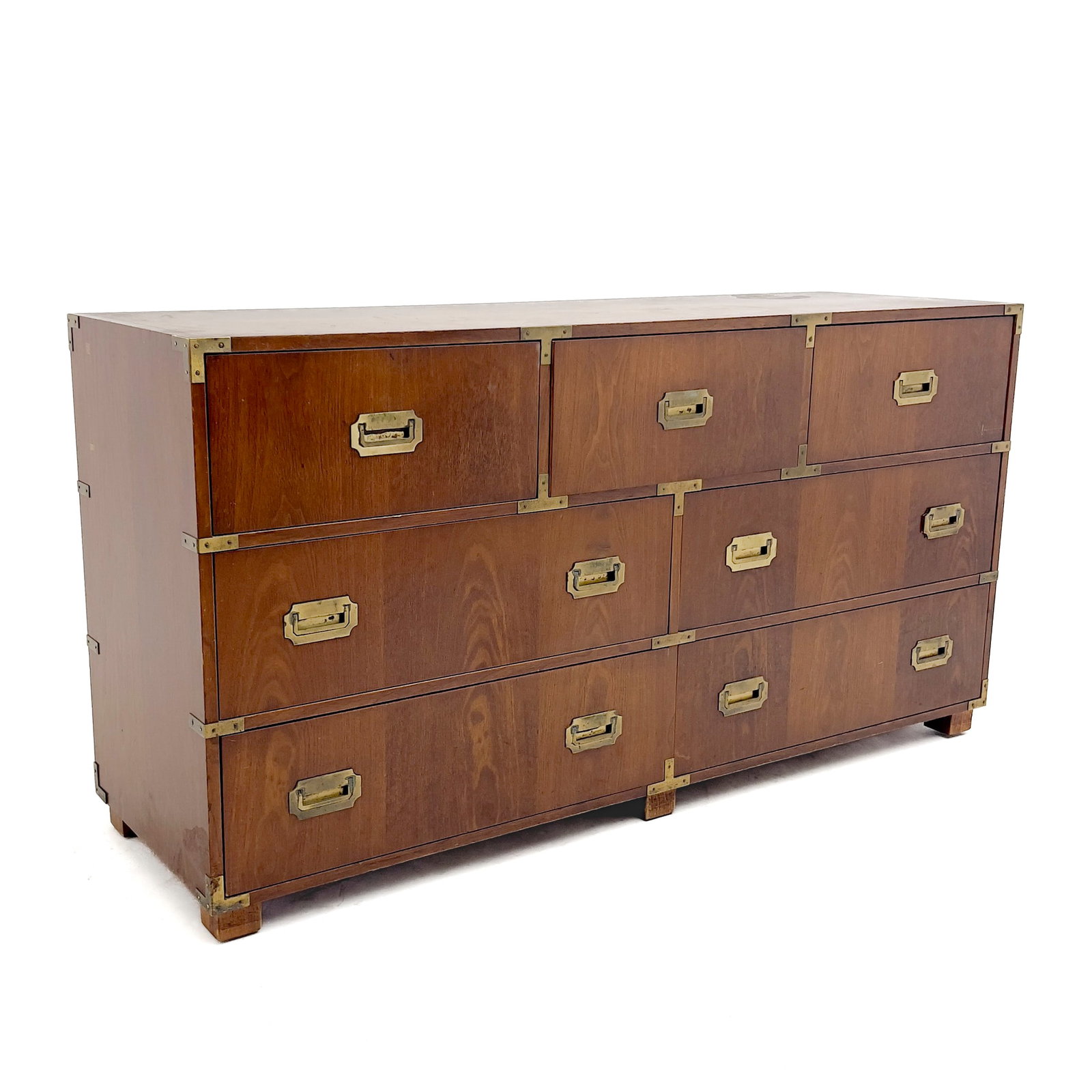 Baker Furniture - Campaign Style Triple Dresser: Lot 65 Baker Furniture American Manufacturer (Founded 1890) Campaign Style Triple Dresser (20th Century) walnut, brass 32 x 62 x 19 inches Description: A Baker Furniture Campaign style triple dresser