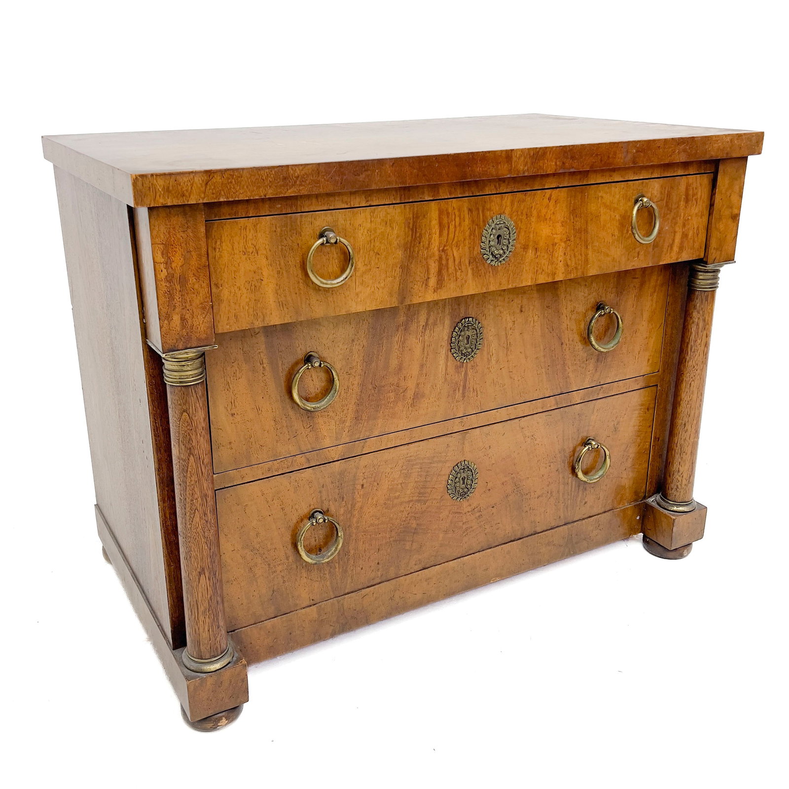 Baker Furniture - Empire Style Chest with Columns: Lot 66 Baker Furniture American Manufacturer (Founded 1890) Empire Style Chest with Columns (20th Century) fruitwood, brass 25 1/2 x 33 1/2 x 19 1/4 inches Description: A Baker Furniture Empire style