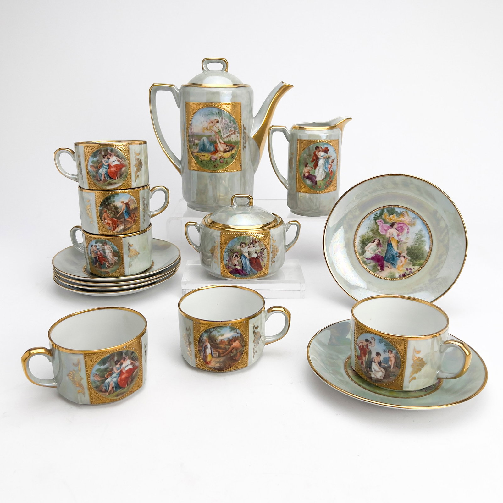 Vienna Style Coffee and Tea Service: Lot 121 Vienna Style Coffee and Tea Service porcelain height (pot): 9 inches each marked Description: Comprising of a lidded pot, lidded sugar bowl, cream jug, six cups and six saucers in a mother-of 