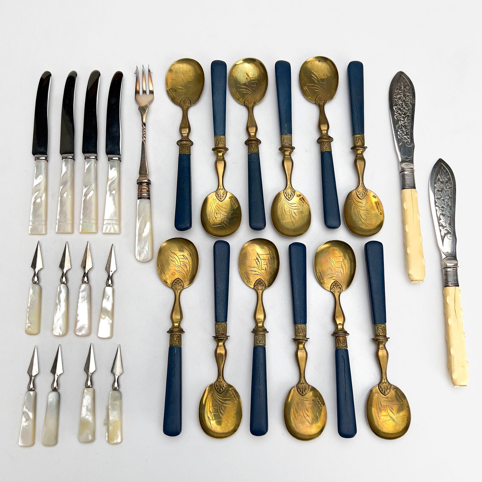 Victorian and Aesthetic Movement Flatware: Lot 122 Victorian and Aesthetic Movement Flatware each spoon: 6 1/4 inches Description: Comprising 12 B. Altman (Theo) etched brass spoons with composition handles, mother of pearl handled pieces incl