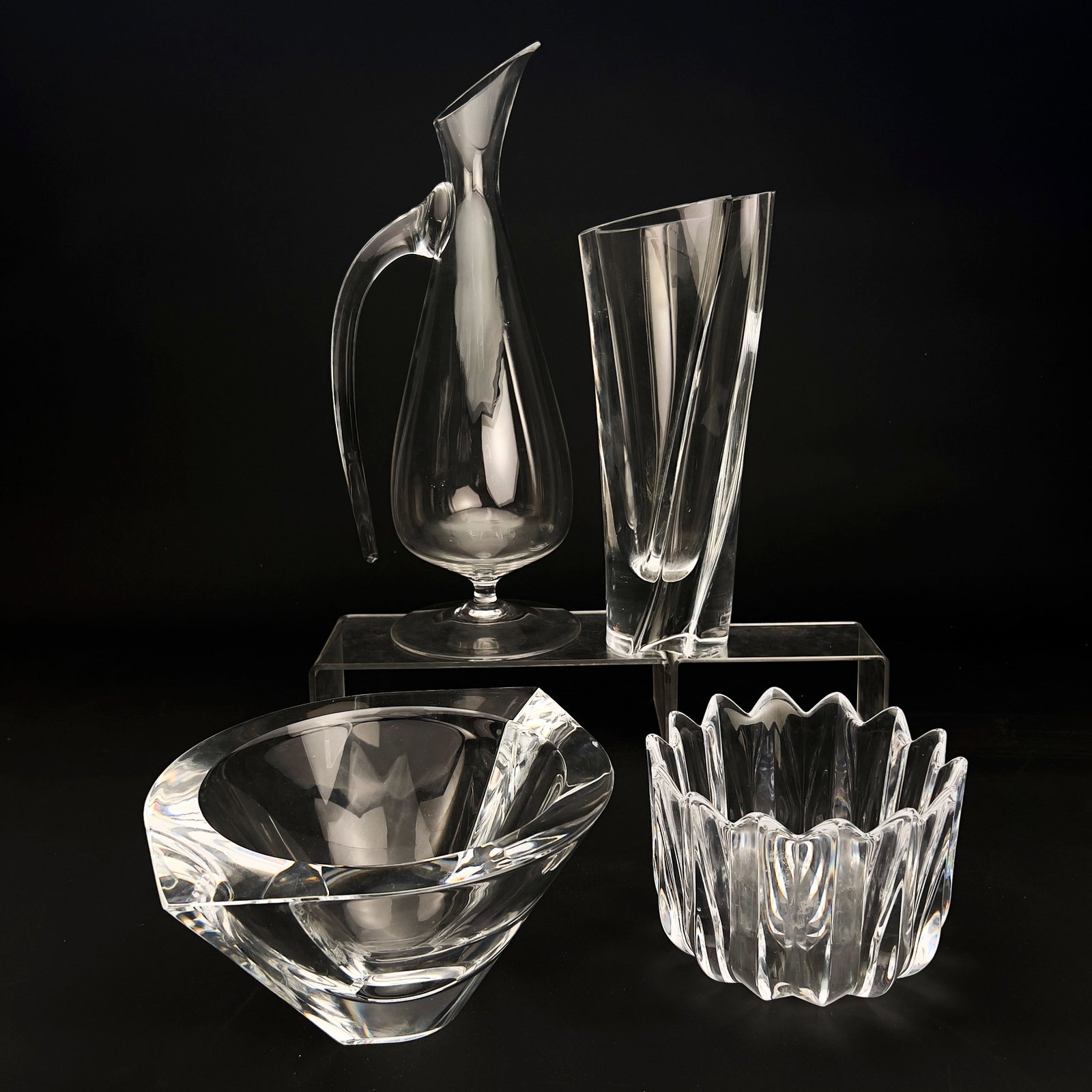 A Collection of Four Scandinavian and Austrian Art Glass Vessels: Lot 134 A Collection of Four Scandinavian and Austrian Art Glass Vessels Heavy-blown clear crystal and molded glass height (tallest): 16 inches each mark etched to undersides Description: A group of