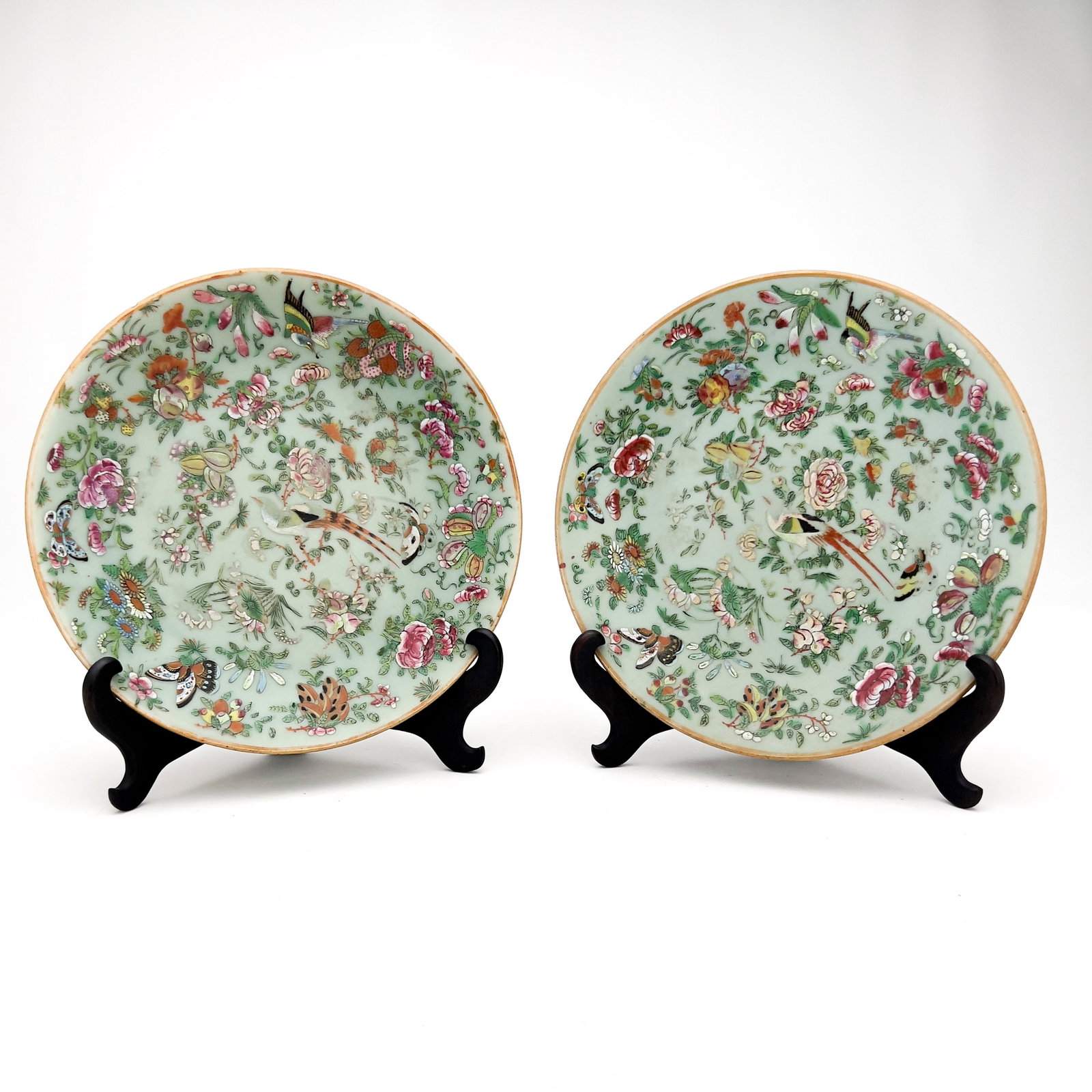 Pair of Chinese Canton Famille Rose Celadon Plates: Lot 166 Pair of Chinese Canton Famille Rose Celadon Plates porcelain diameter: 10 inches Description: A pair of Canton export porcelain famille rose plates in a celadon glaze, with hand-painted butter