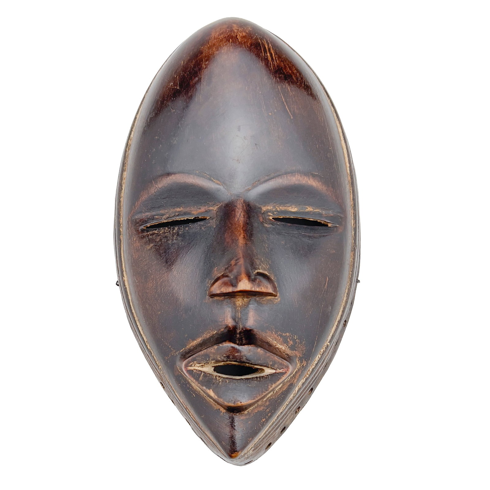 Ceremonial Dan Mask: Lot 177 Ceremonial Dan Mask wood 9 1/2 x 5 3/4 x 3 1/2 inches Description: A Dan peoples face mask from Côte d'Ivoire or Liberia is carved from wood with a dark brown patina and features a high, 