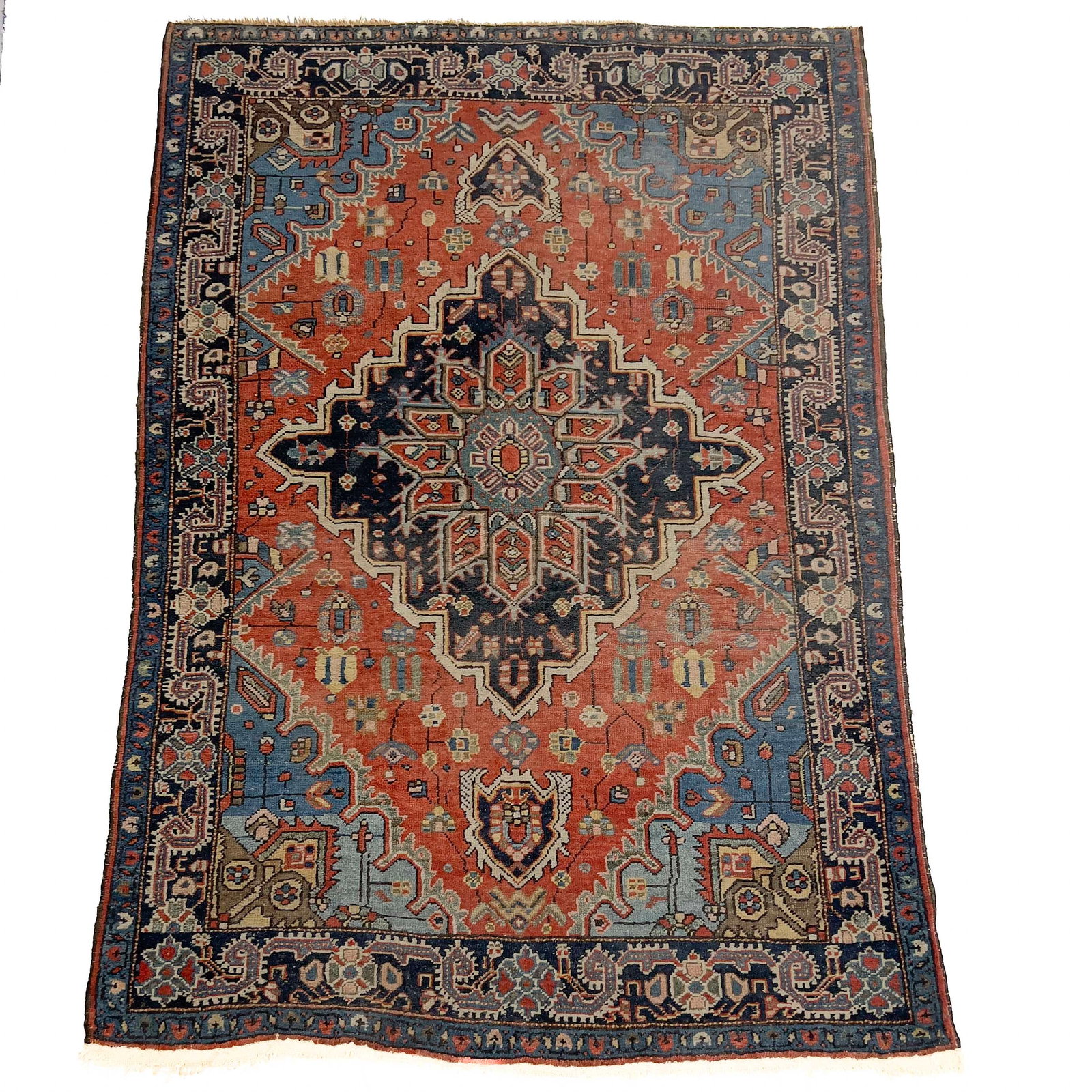 Antique Persian Heriz Area Rug: Lot 194 Antique Persian Heriz Area Rug (19th/20th Century) Wool, Cotton Description: An antique hand-knotted Persian Heriz area rug woven with a wool pile on a cotton foundation, featuring a large, an