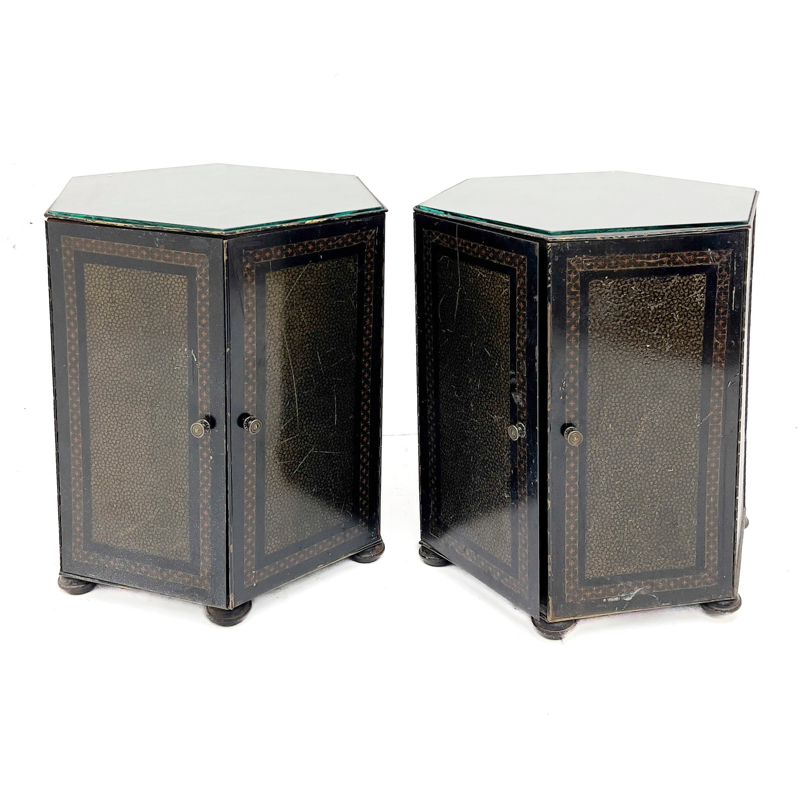 Pair of Hexagonal End Tables: Lot 171 Pair of Hexagonal End Tables Metal, glass 21 1/4 x 17 1/2 x 17 1/2 inches Description: A pair of hexagonal metal side cabinets, each configured with a glass inset top and two hinged panelled