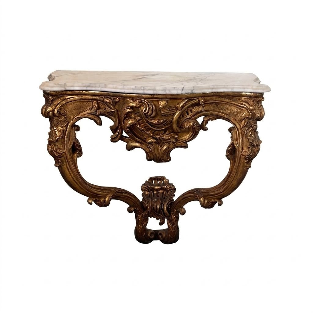 A Louis XV Giltwood and Marble-Top Hanging Console Table: Lot 228 A Louis XV Giltwood and Marble-Top Hanging Console Table (Late 18th or Early 19th Century) Wood, Gesso, Gold Leaf, Marble 31 x 33 1/2 x 20 7/8 inches Description: An antique Louis XV hanging c