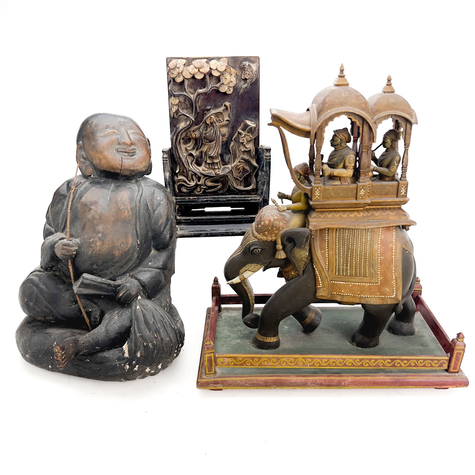 An Assembled Group of Three Asian Wooden Figural Carvings and Sculptures: Lot 4 An Assembled Group of Three Asian Wooden Figural Carvings and Sculptures ( 19th/20th Century) Wood, gilt lacquer, polychrome enamel, pigment elephant: 19 x 15 3/4 x 8 3/4 inches Description: An