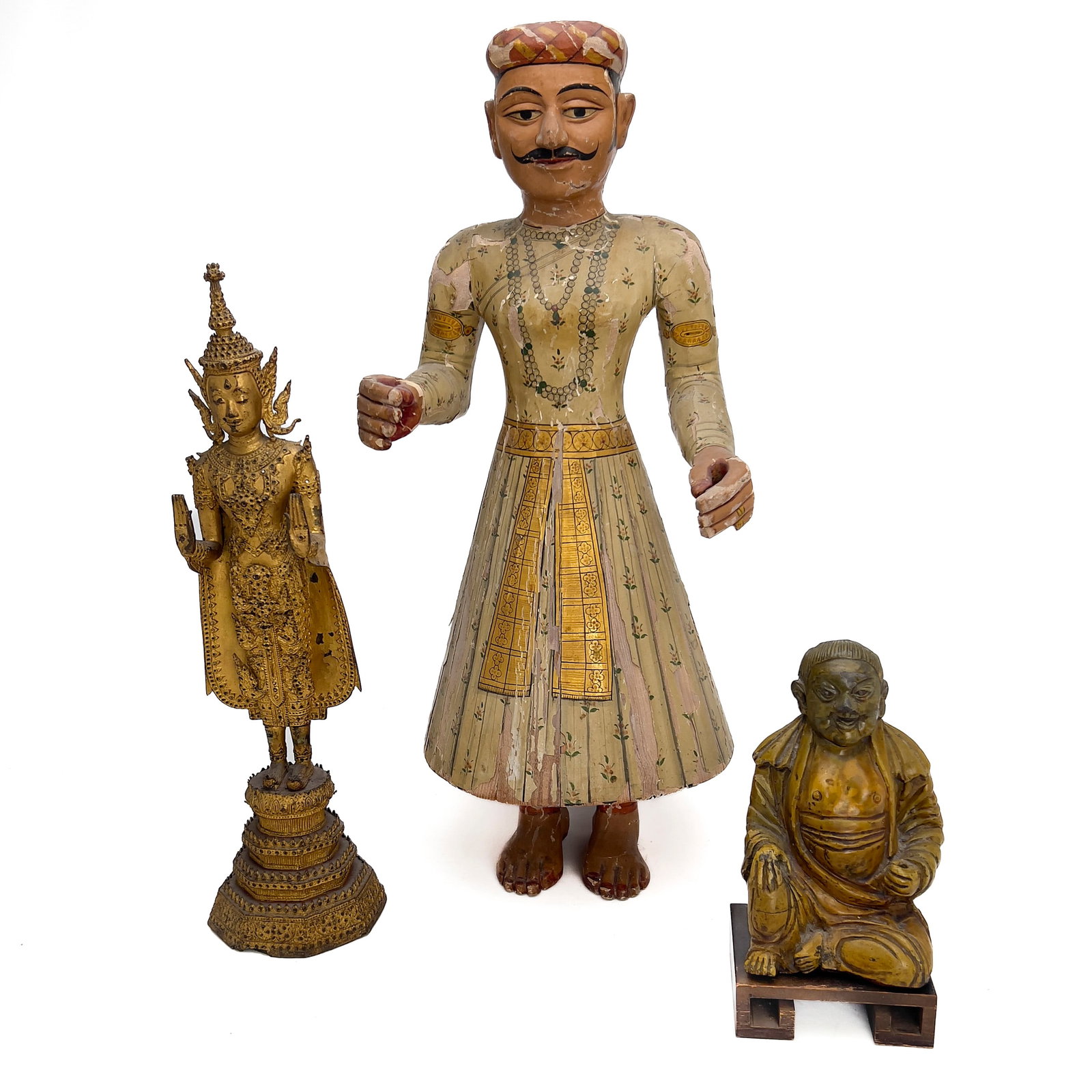 A Group of Three South and Southeast Asian Figures: Lot 7 A Group of Three South and Southeast Asian Figures (19th or 20th Century) wood, bronze, gold leaf, glass, core clay, ceramic, gesso, pigment, glaze largest: 28 x 11 x 13 inches Description: A