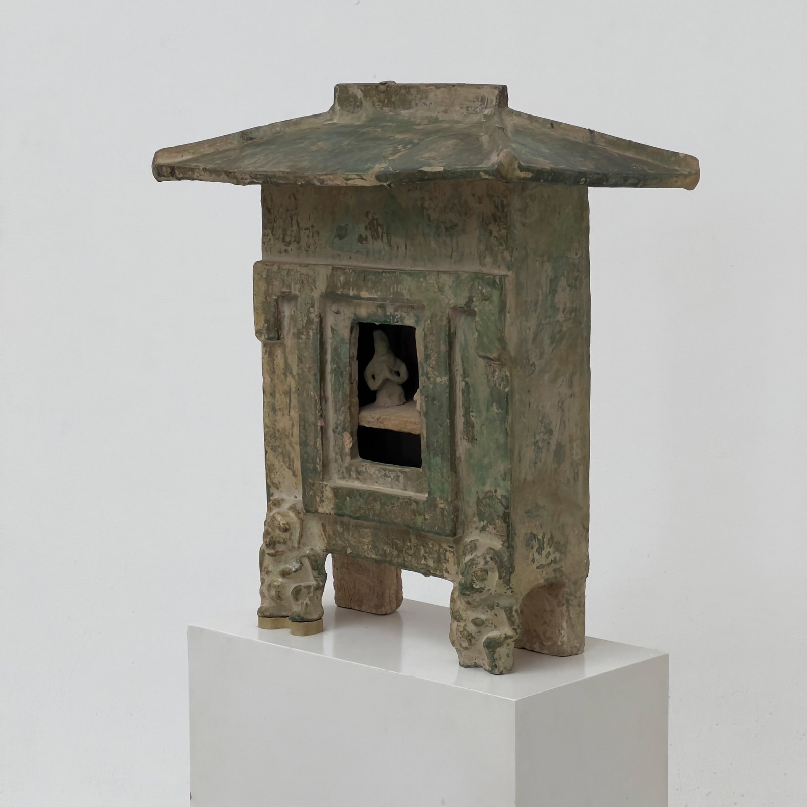 Chinese Han Dynasty funerary Green Glazed House Model, with pedestal: Lot 10 Chinese Han Dynasty funerary Green Glazed House Model, with pedestal earthenware 22 x 19 x 10 1/2 inches Description: An earthenware funerary architectural model of a rectangular granary,