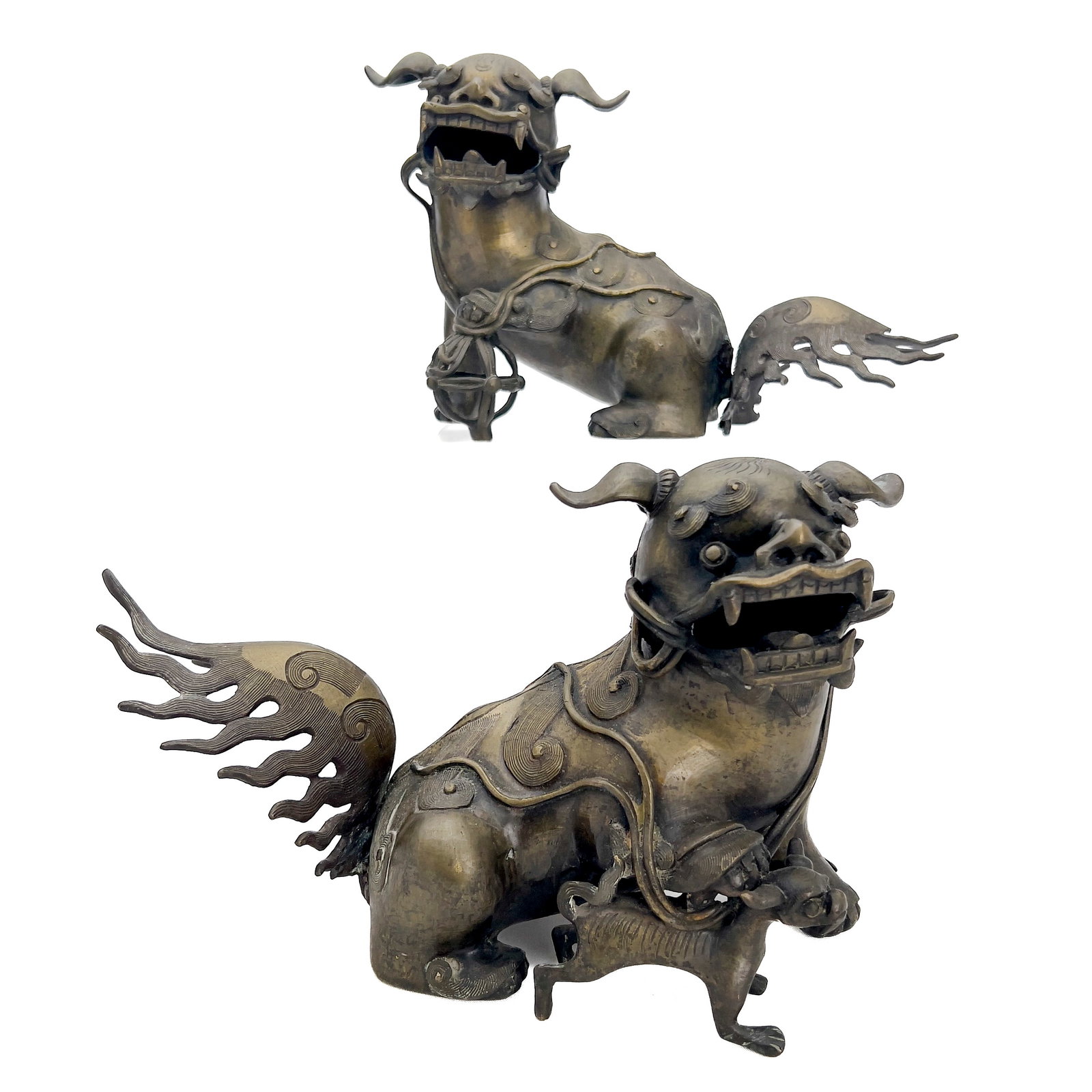A Pair of Asian Bronze Foo Dogs: Lot 27 A Pair of Asian Bronze Foo Dogs (19th/20th Century) Bronze each: 7 1/2 x 12 x 4 1/2 inches Description: A matching pair of Chinese export cast bronze guardian lions (foo dogs) sculpted in seate