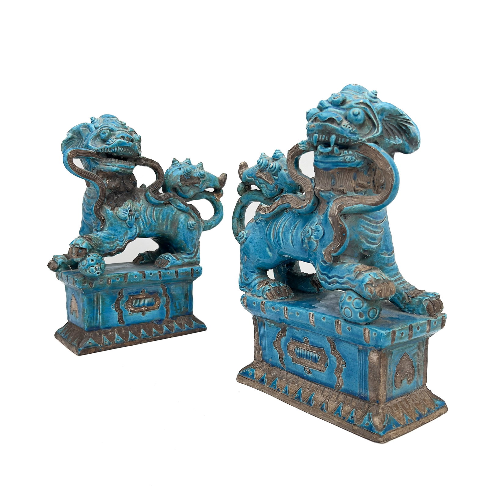 A Pair of Chinese Glazed Turquoise Ceramic Guardian Lions: Lot 41 A Pair of Chinese Glazed Turquoise Ceramic Guardian Lions (Late Qing Dynasty / Republic Period) Ceramic, turquoise glaze 12 1/2 x 10 1/2 x 4 1/4 inches Description: A pair of Chinese export tur