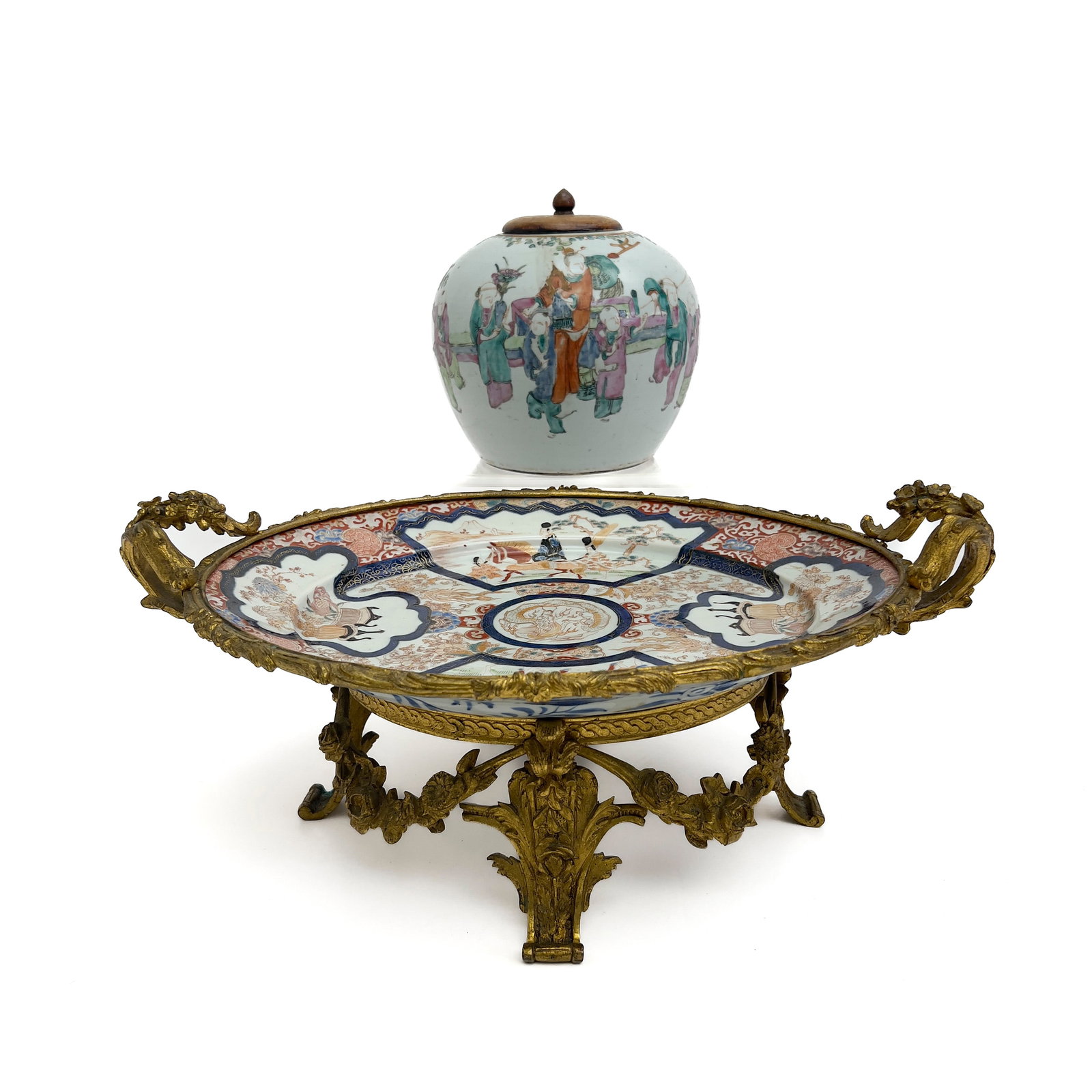 Japanese Imari Porcelain Platter and Chinese Export Porcelain Ginger Jar Lot: Lot 45 Japanese Imari Porcelain Platter and Chinese Export Porcelain Ginger Jar Lot Porcelain, Glaze, Enamel, Gold leaf, Gilt bronze, Hardwood, Wax mounted platter: 8 x 19 1/2 x 13 1/4 inches jar (wit