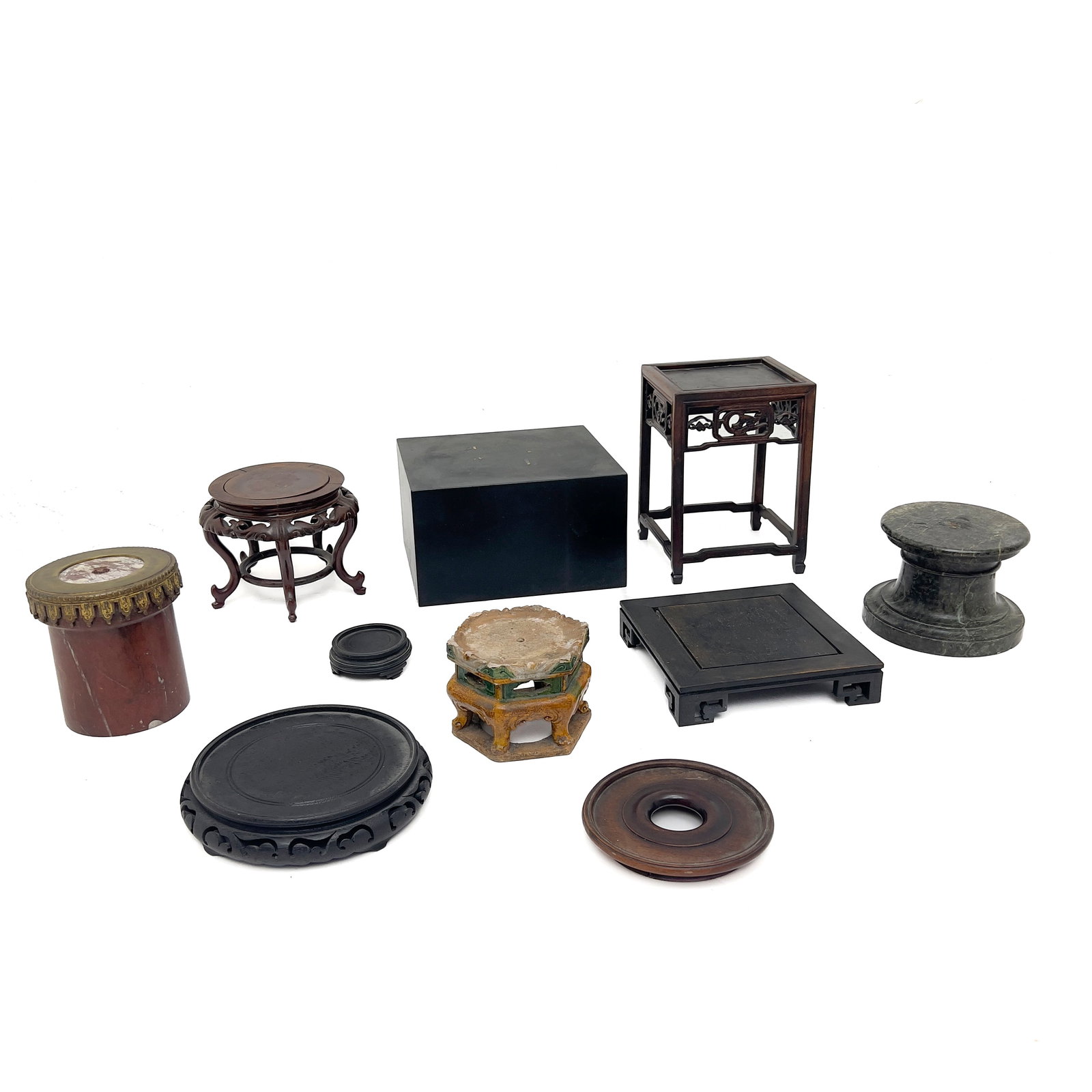 Group of Ten Chinese and Continental Display Stands: Lot 81 Group of Ten Chinese and Continental Display Stands Hardwood, marble, ceramic, metal tall wood stand: 10 x 7 x 7 inches Description: A varied ten-piece assortment of Chinese and continental dec