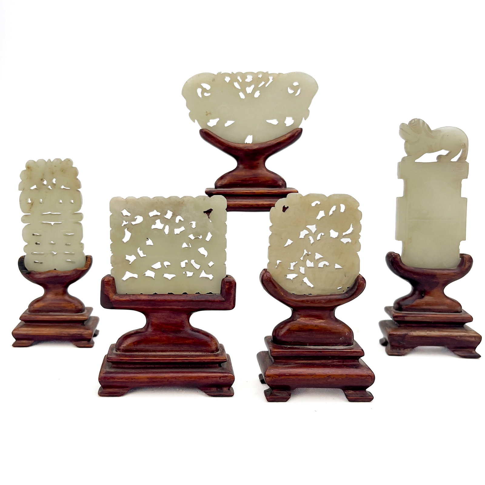 Group of Five Chinese Carved Jade Plaques on Wood Stands: Lot 89 Group of Five Chinese Carved Jade Plaques on Wood Stands (Qing Dynasty to Republic Period, 19th/20th Century) White nephrite, jade, hardwood tallest: 5 1/2 x 2 x 1 inches Description: A collect