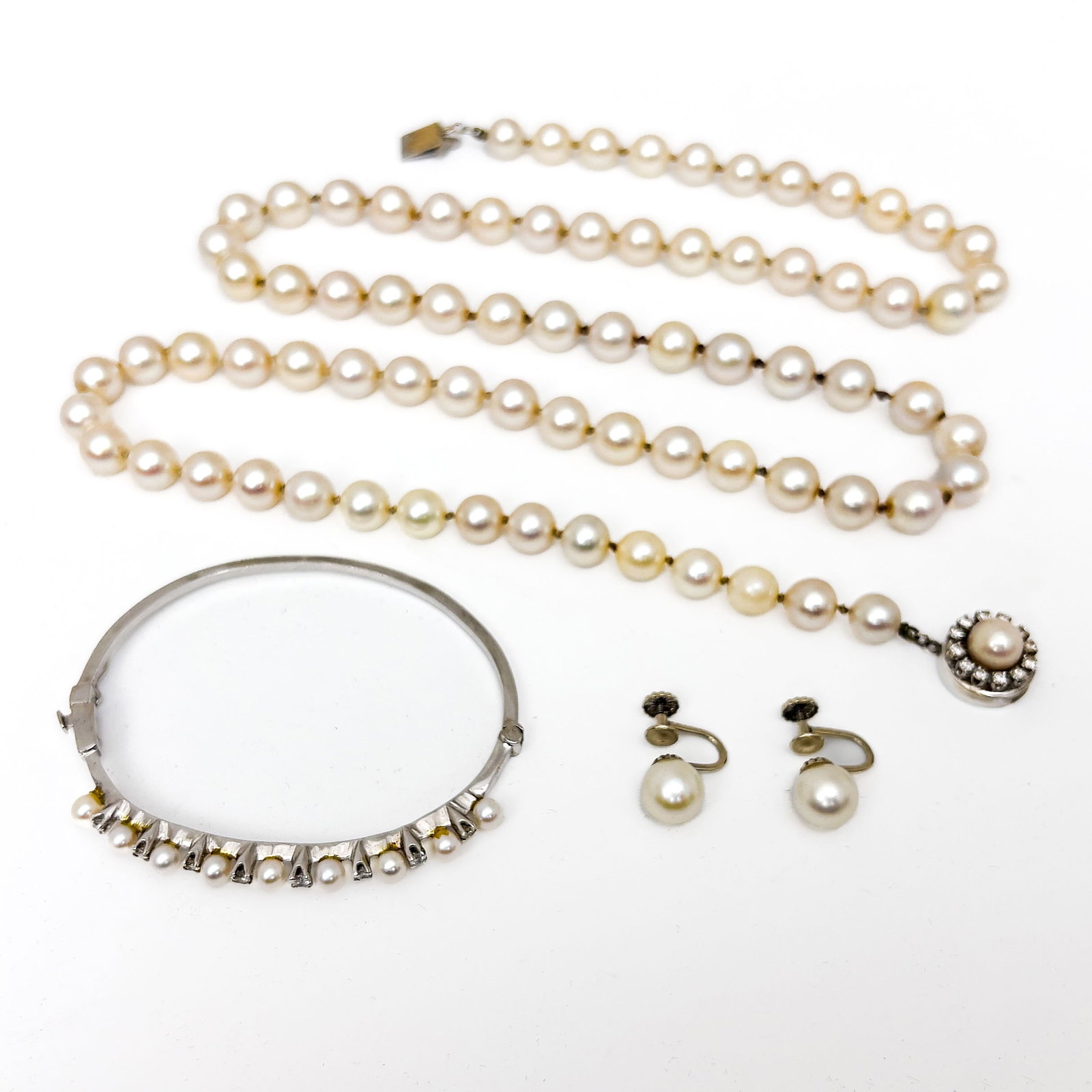 A Cultured Pearl and Diamond Three-Piece Jewelry Selection (1 of 5)