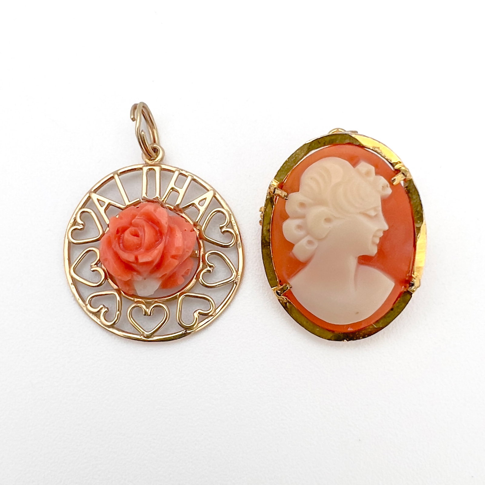 Gold Pendant and Silver Cameo: Lot 99 Gold Pendant and Silver Cameo 14k gold, sterling silver, coral stamped Description: 14k yellow gold pendant with carved coral rose (1.9 grams) and a gold finished sterling silver cameo (3.2 gra