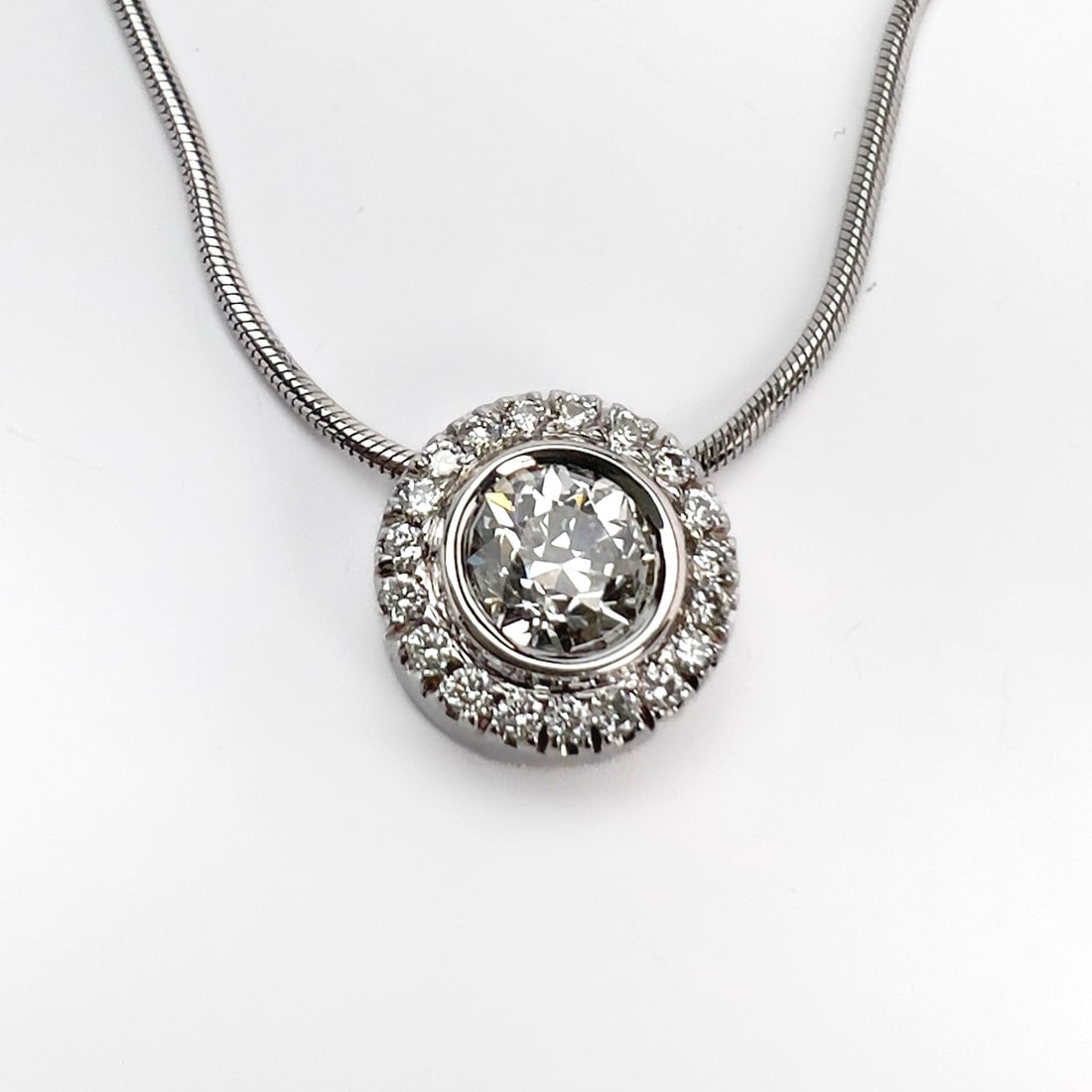Italian 14k White Gold and Diamond Slide Pendant Necklace: Lot 114 Italian 14k White Gold and Diamond Slide Pendant Necklace 14k white gold, diamond length: 18 1/2 inches stamped Description: A contemporary Italian 14k white gold necklace comprising an