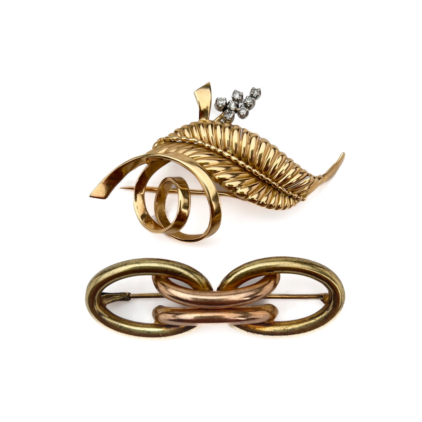 A two-piece 14k gold and platinum brooch lot containing diamonds (1 of 3)