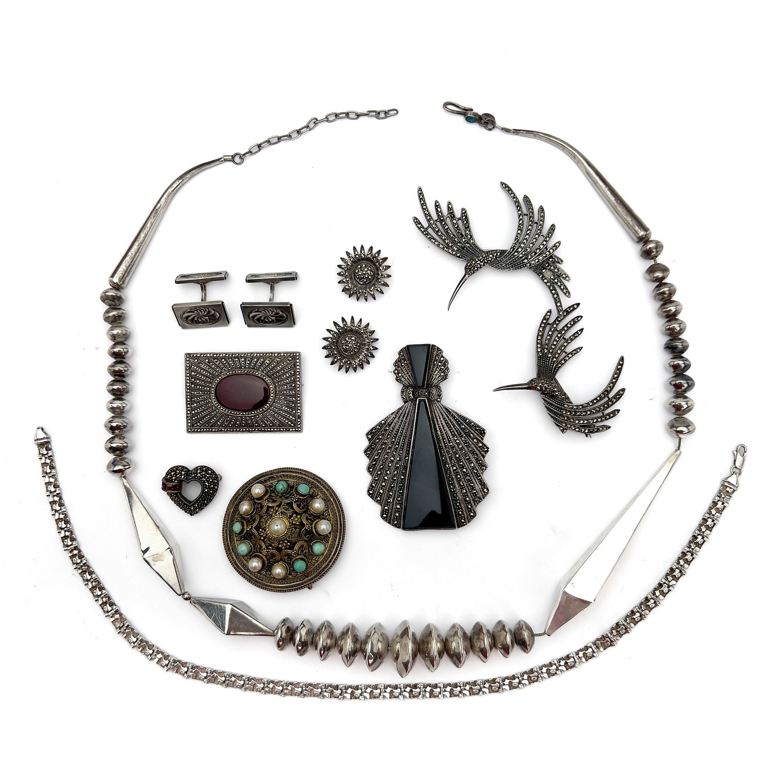 A Sterling Silver Jewelry Group, Judith Jack, Georg Jensen, and Other Makers: Lot 129 A Sterling Silver Jewelry Group, Judith Jack, Georg Jensen, and Other Makers (20th Century) Sterling silver, 935 silver, marcasite, onyx, ruby, garnet, cultured pearl, turquoise, carnelian