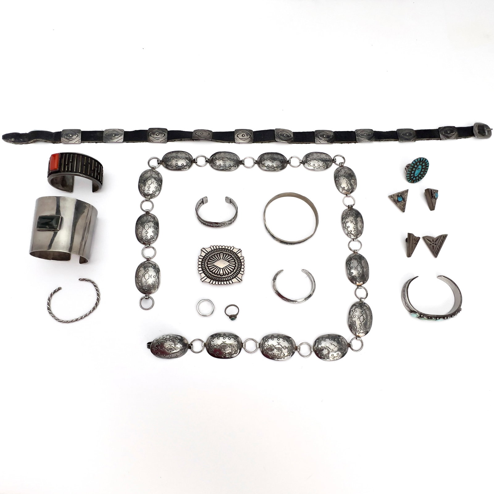 A Southwestern Sterling Silver Jewelry Group, Marcella James, Kirk, and Other Makers: Lot 130 A Southwestern Sterling Silver Jewelry Group, Marcella James, Kirk, and Other Makers (20th Century) Sterling silver, coral, turquoise, leather silver belt: 37 inches many stamped Description: