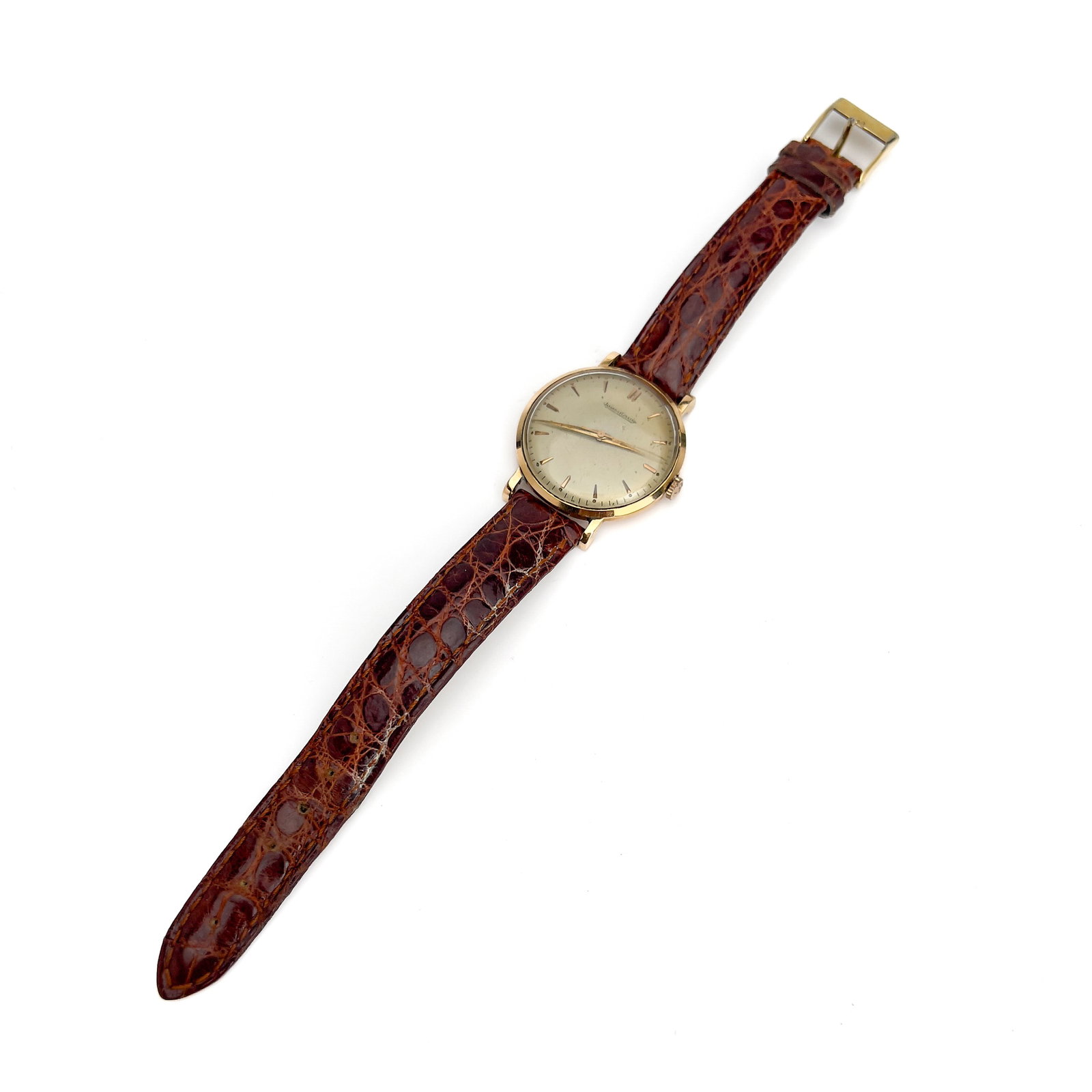 Jaeger-LeCoultre - A Vintage 18k Yellow Gold Gentleman's Wristwatch: Lot 142 Jaeger-LeCoultre Swiss Manufacturer (founded 1833) A Vintage 18k Yellow Gold Gentleman's Wristwatch (circa 1957) 18k yellow gold, crocodile leather, glass, brass, steel stamped Description: A